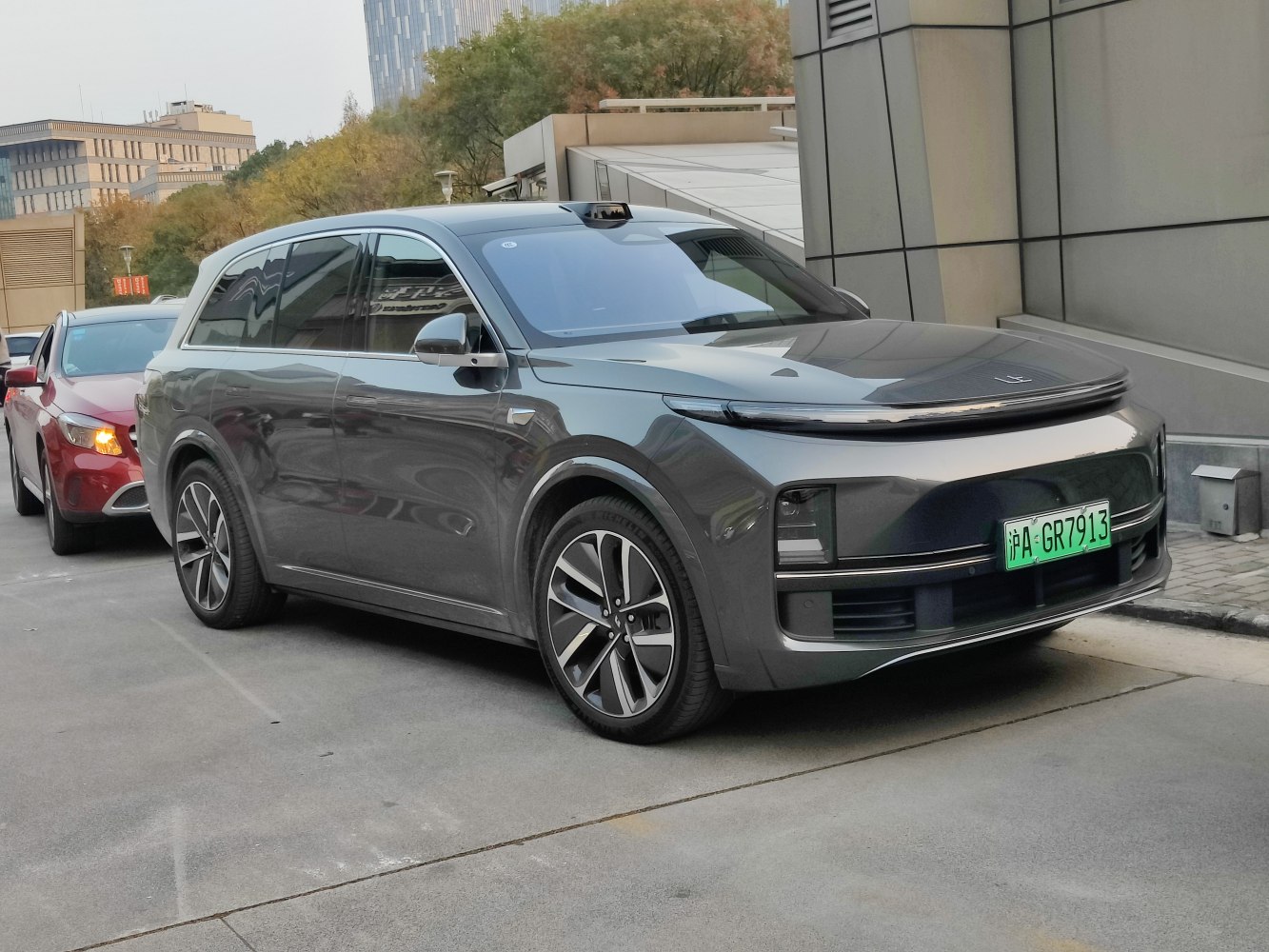 Front side view of a modern SUV with sleek design and large alloy wheels