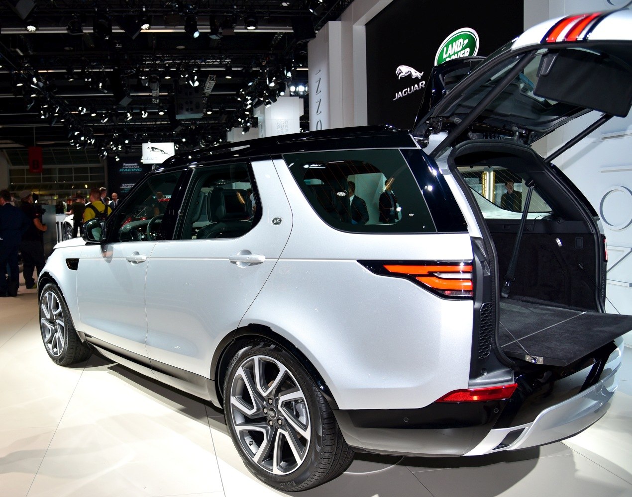 Rear side view of SUV with open tailgate and alloy wheels