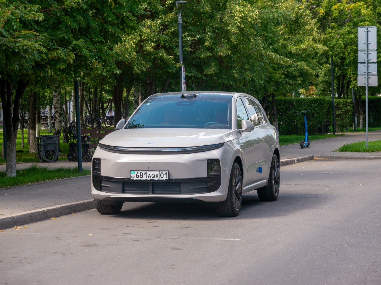 Front view of a modern electric SUV with sleek lighting and aerodynamic design