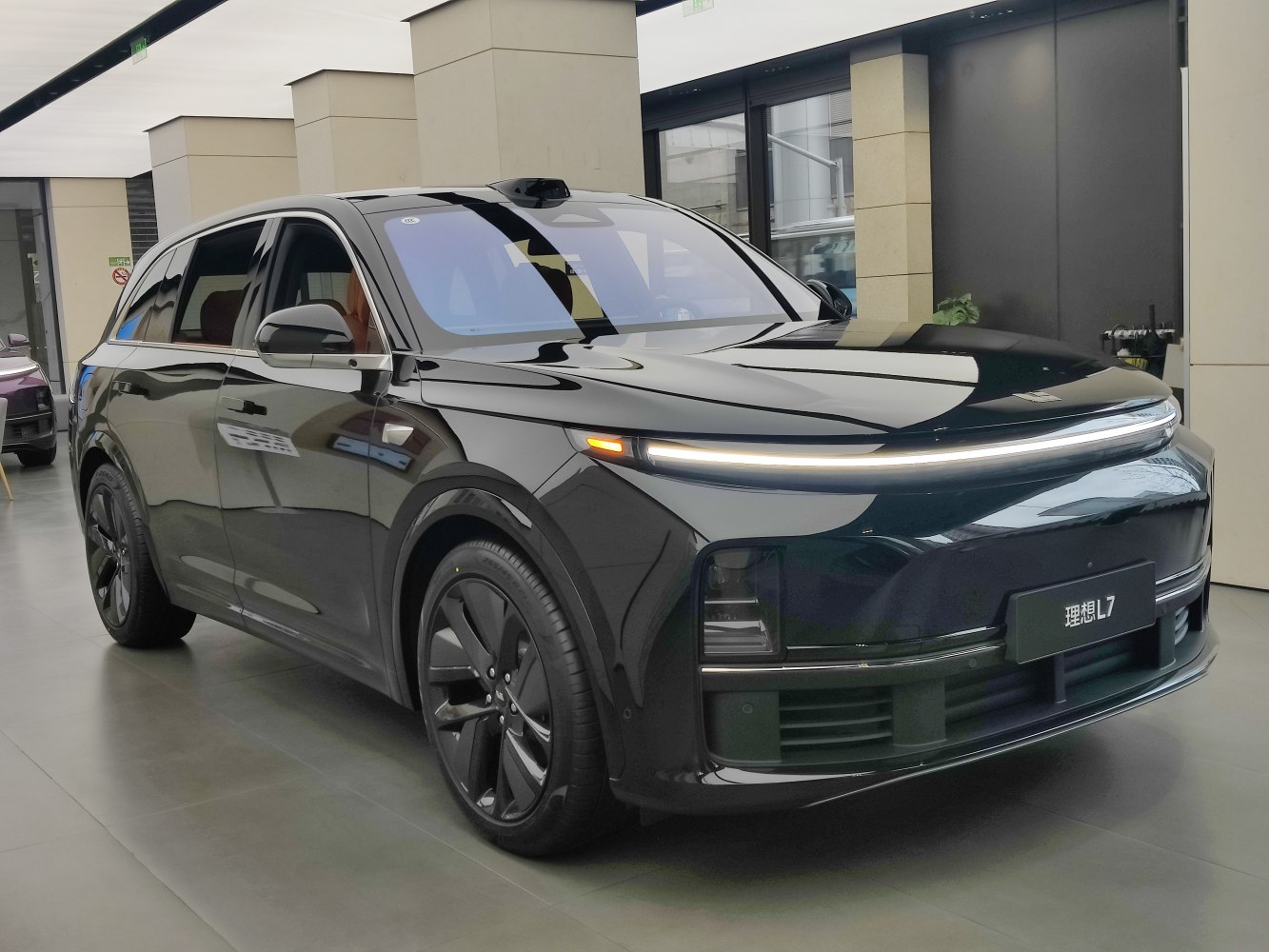 Electric SUV with continuous LED light bar and aerodynamic design