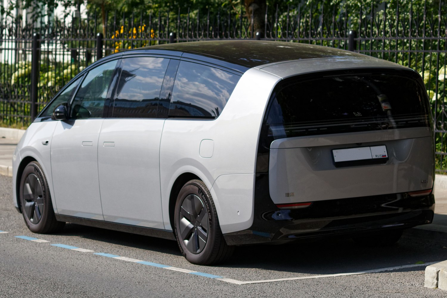 Sleek rear and side design of futuristic electric MPV