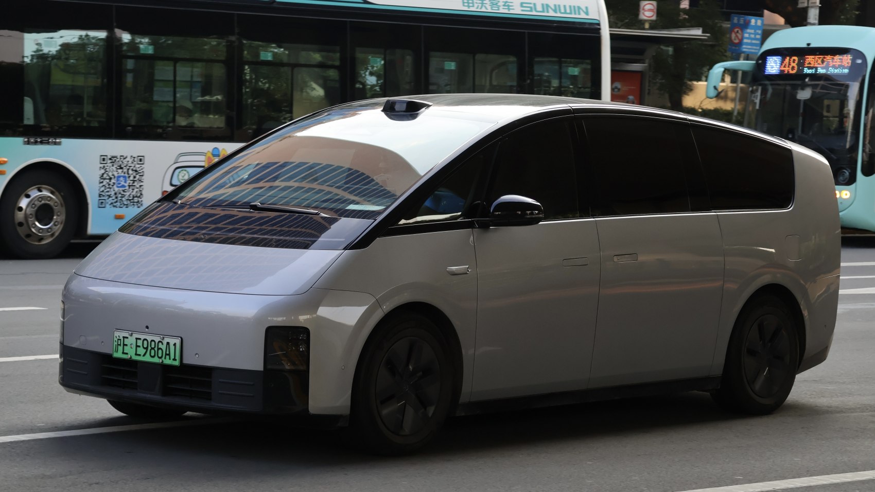 Compact electric minivan with sleek aerodynamic body and tinted windows