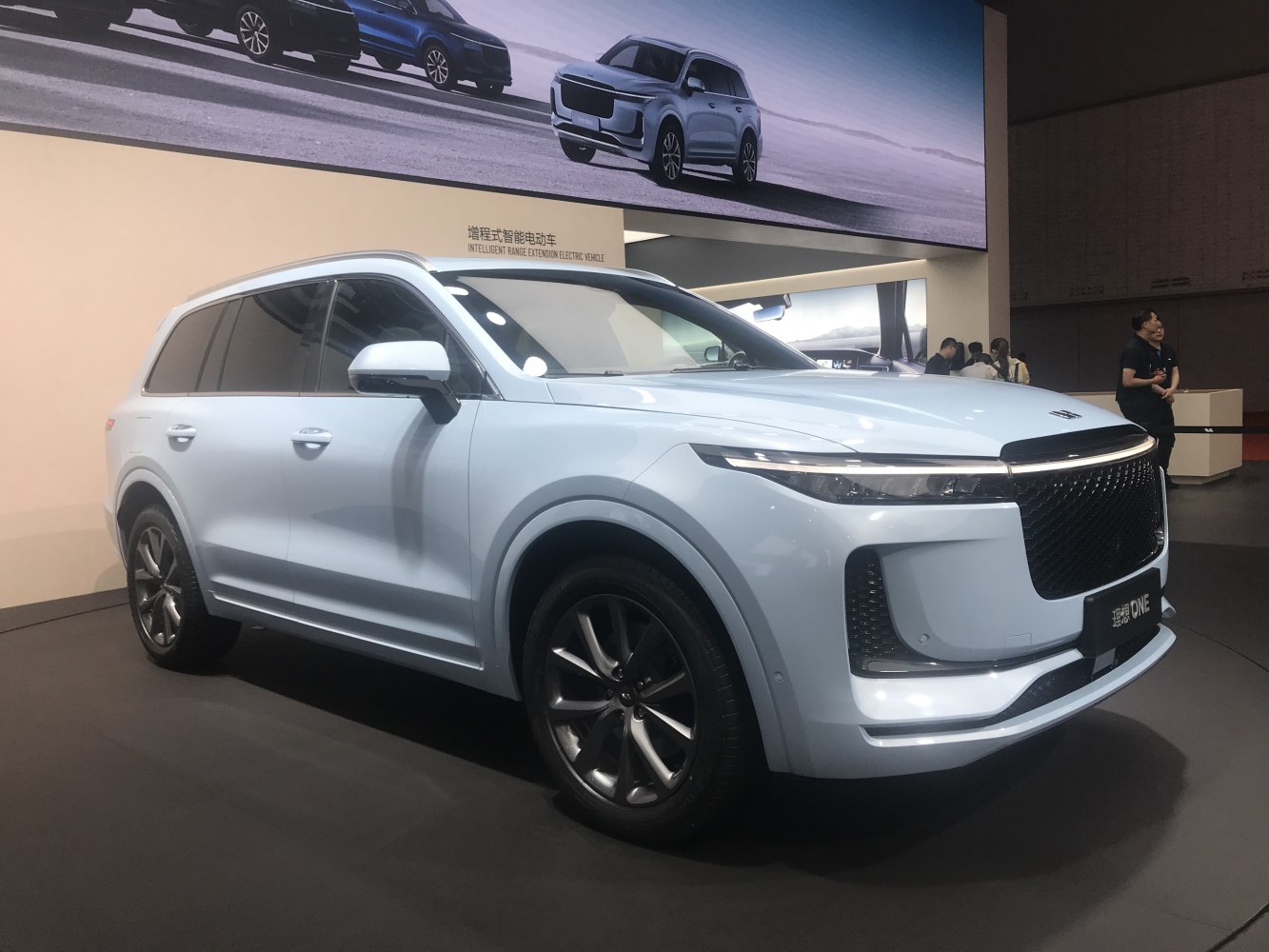 Luxury SUV with sleek front grille and slim LED headlights