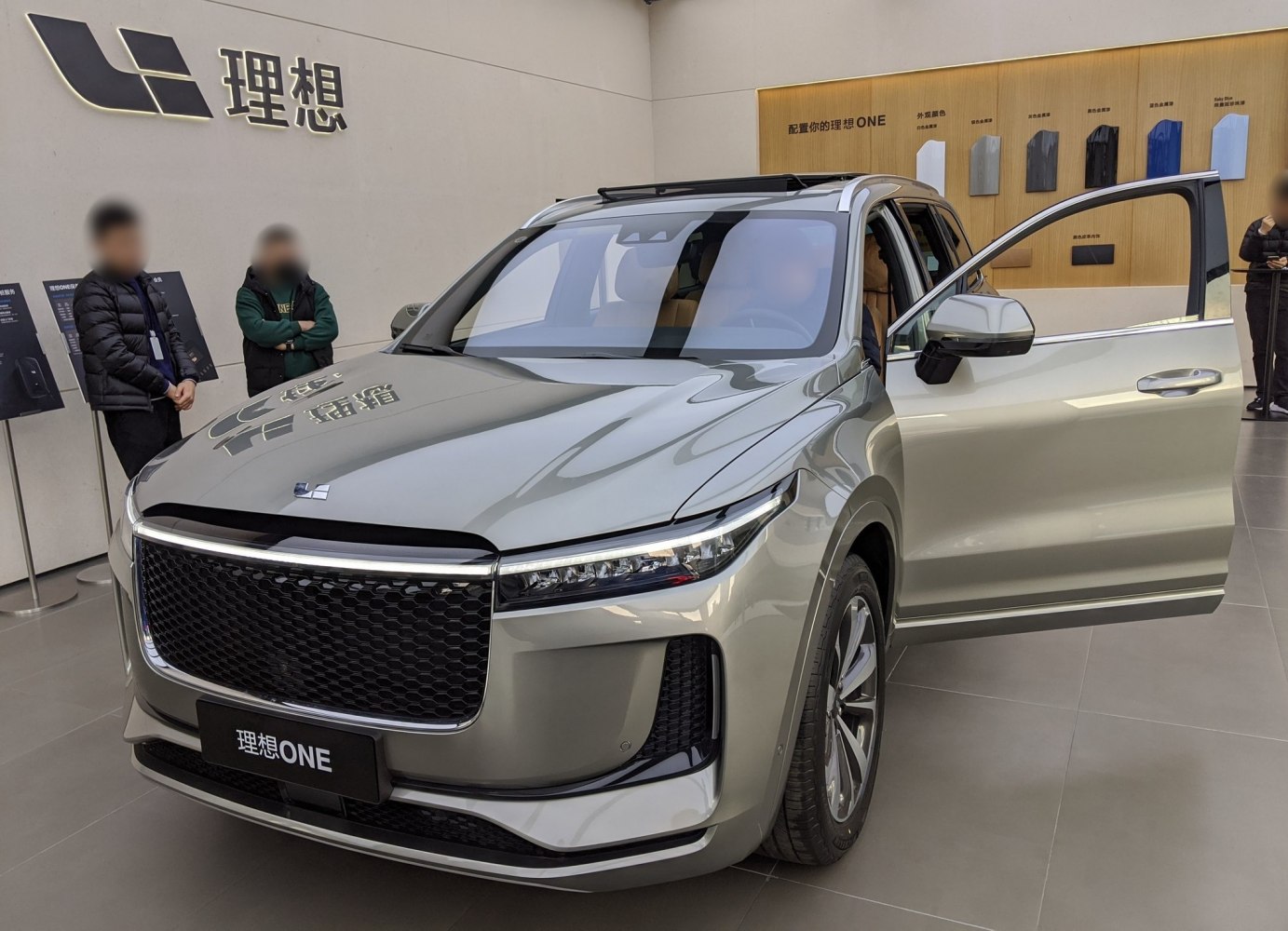 Large front grille, sharp LED headlights, open front door