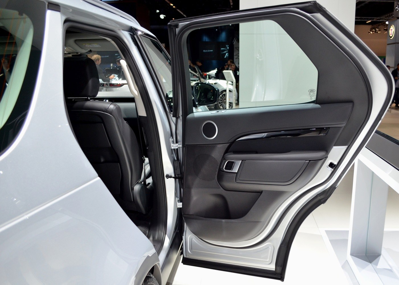 Rear door interior with black leather and speaker