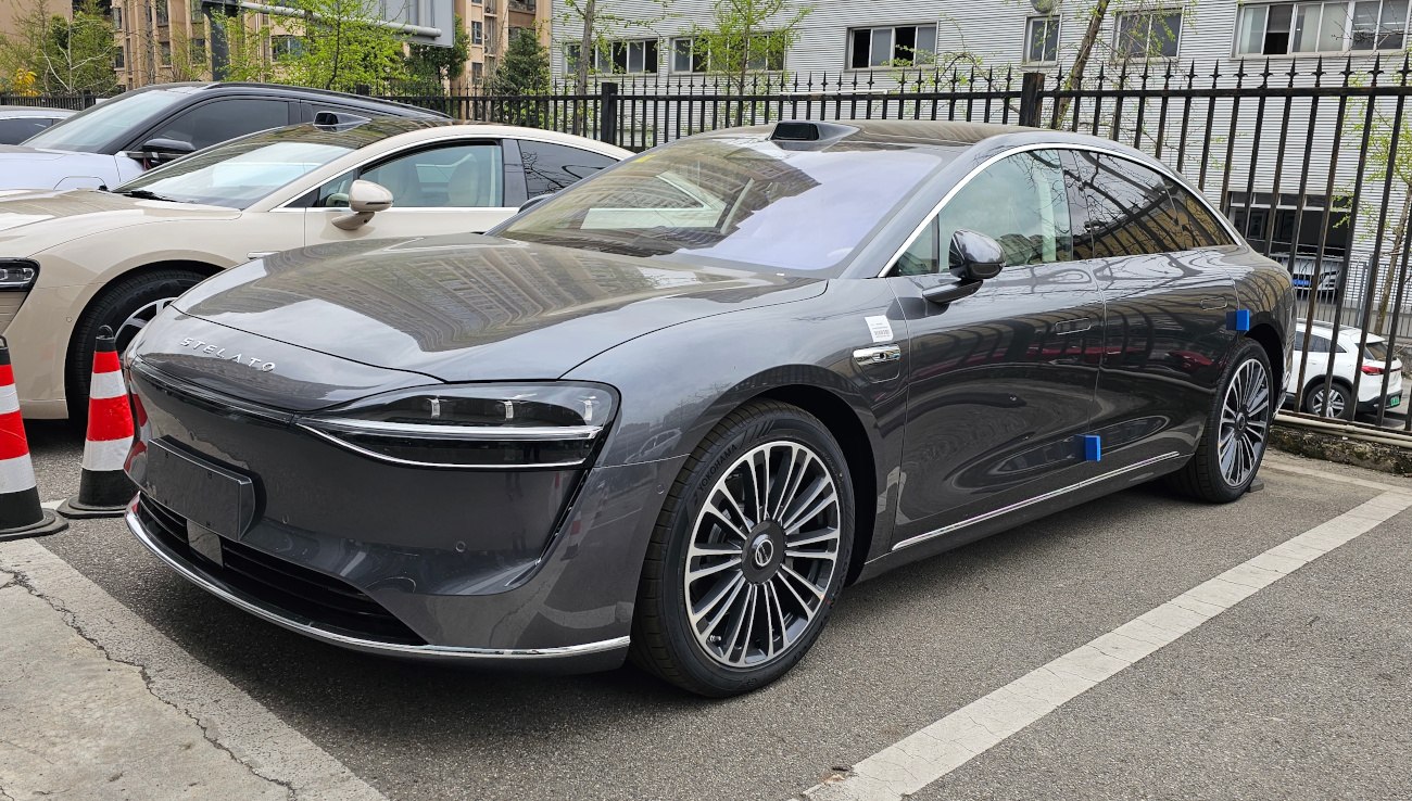 Streamlined sedan with futuristic LED headlights and stylish wheels