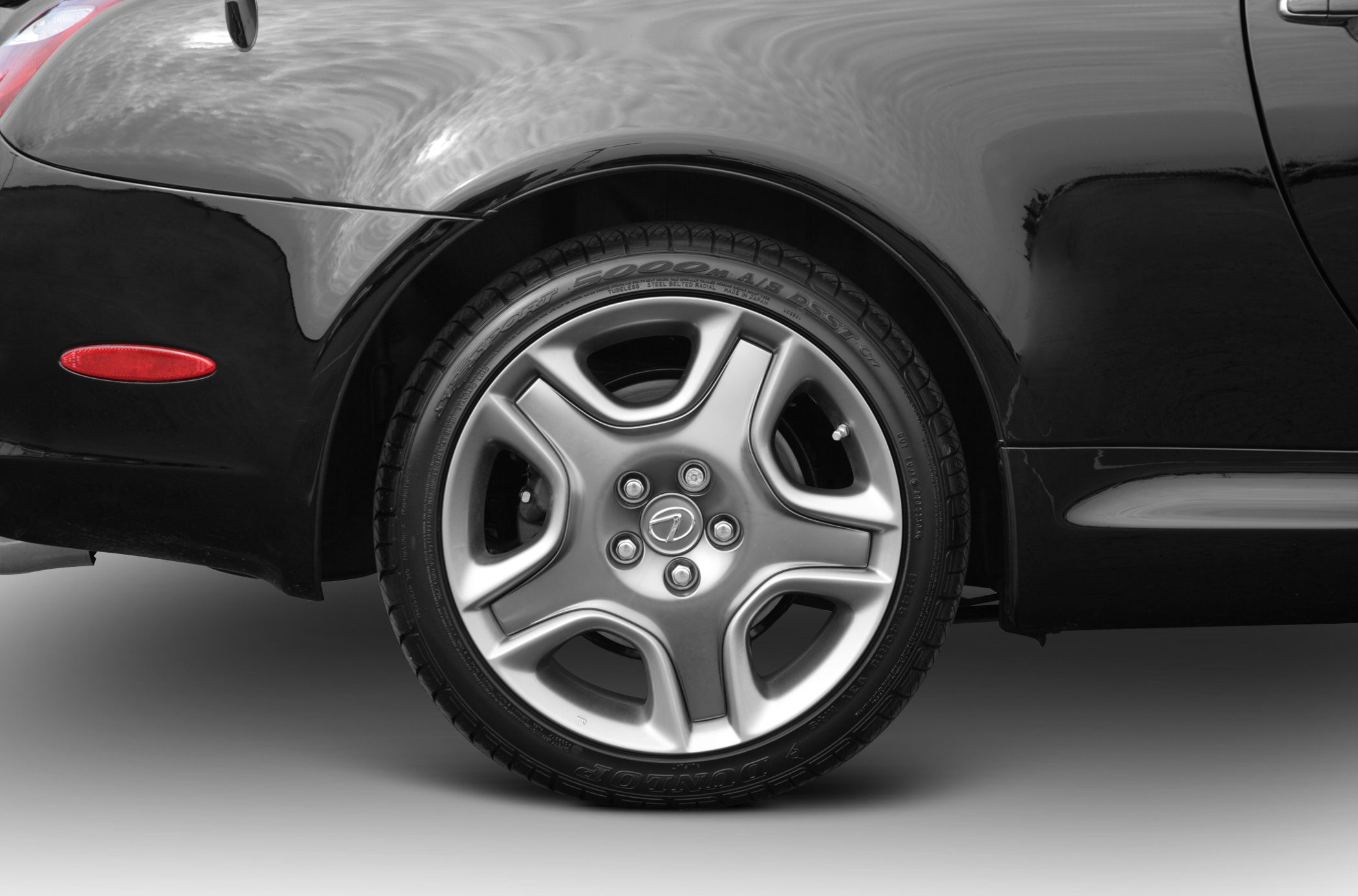 Close-up of a Lexus SC II alloy wheel with Dunlop tire