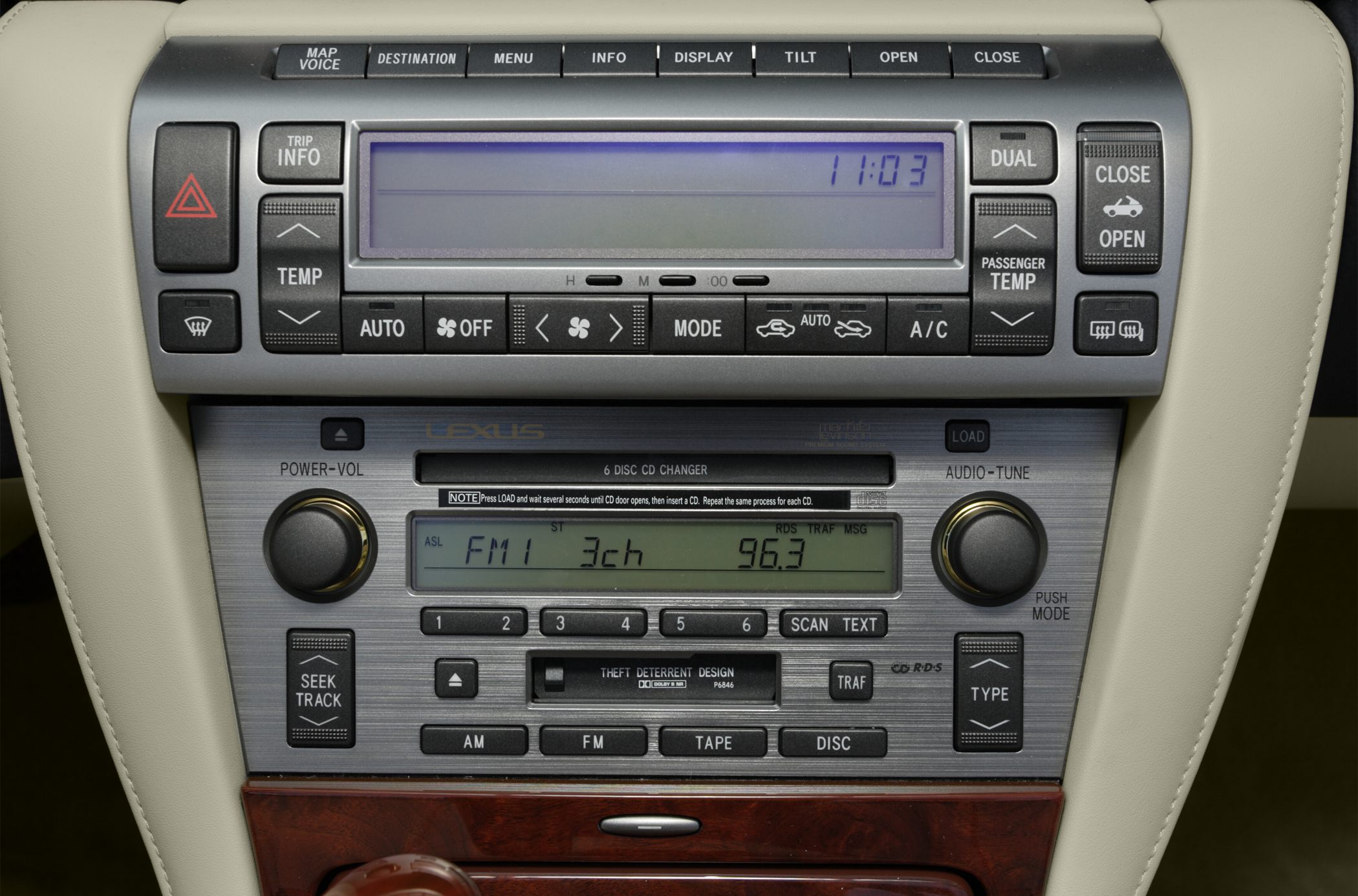 Car radio and climate control panel with CD changer and dual temperature controls