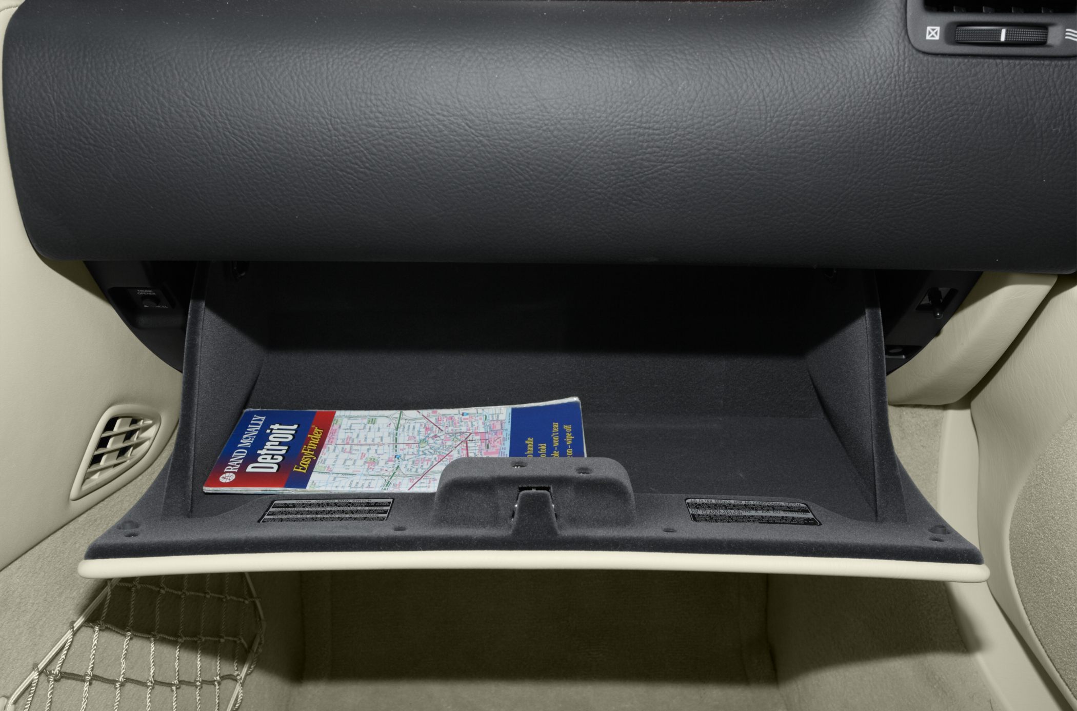 Glove box interior with soft lining and storage space