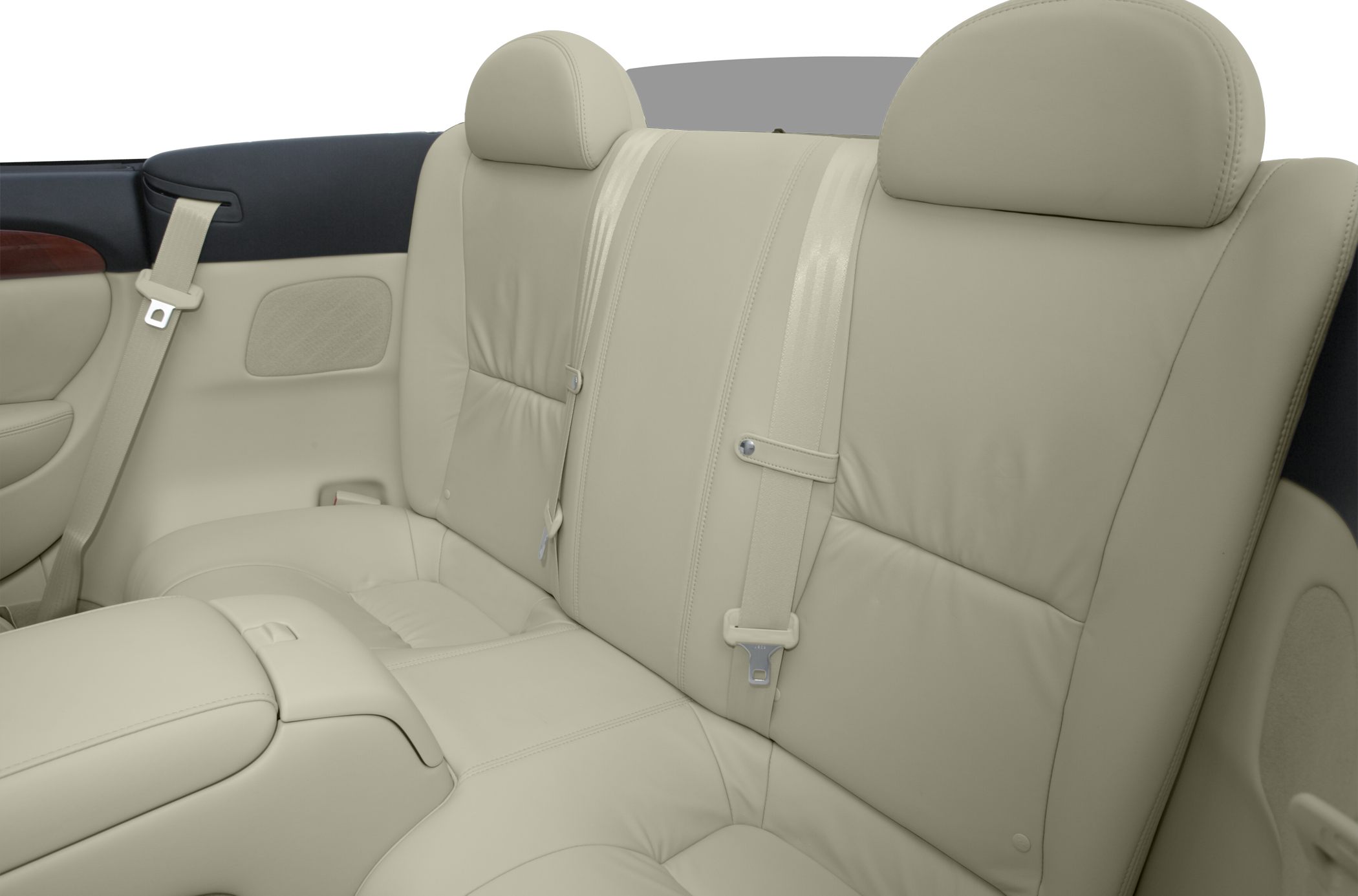 Beige leather rear seats with integrated headrests and seat belts