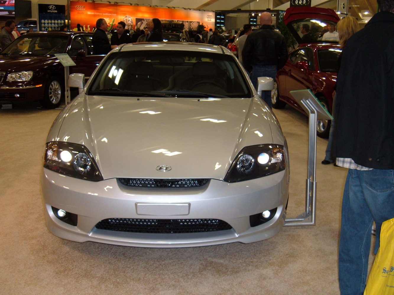 Front view of sports coupe with distinct headlights and grille