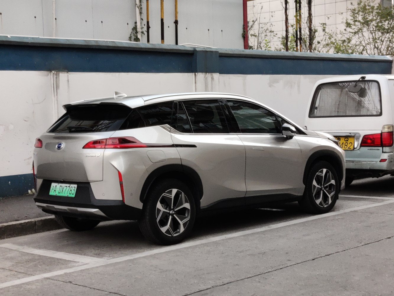 Rear side profile of an electric SUV with sleek tail lights and aerodynamic styling