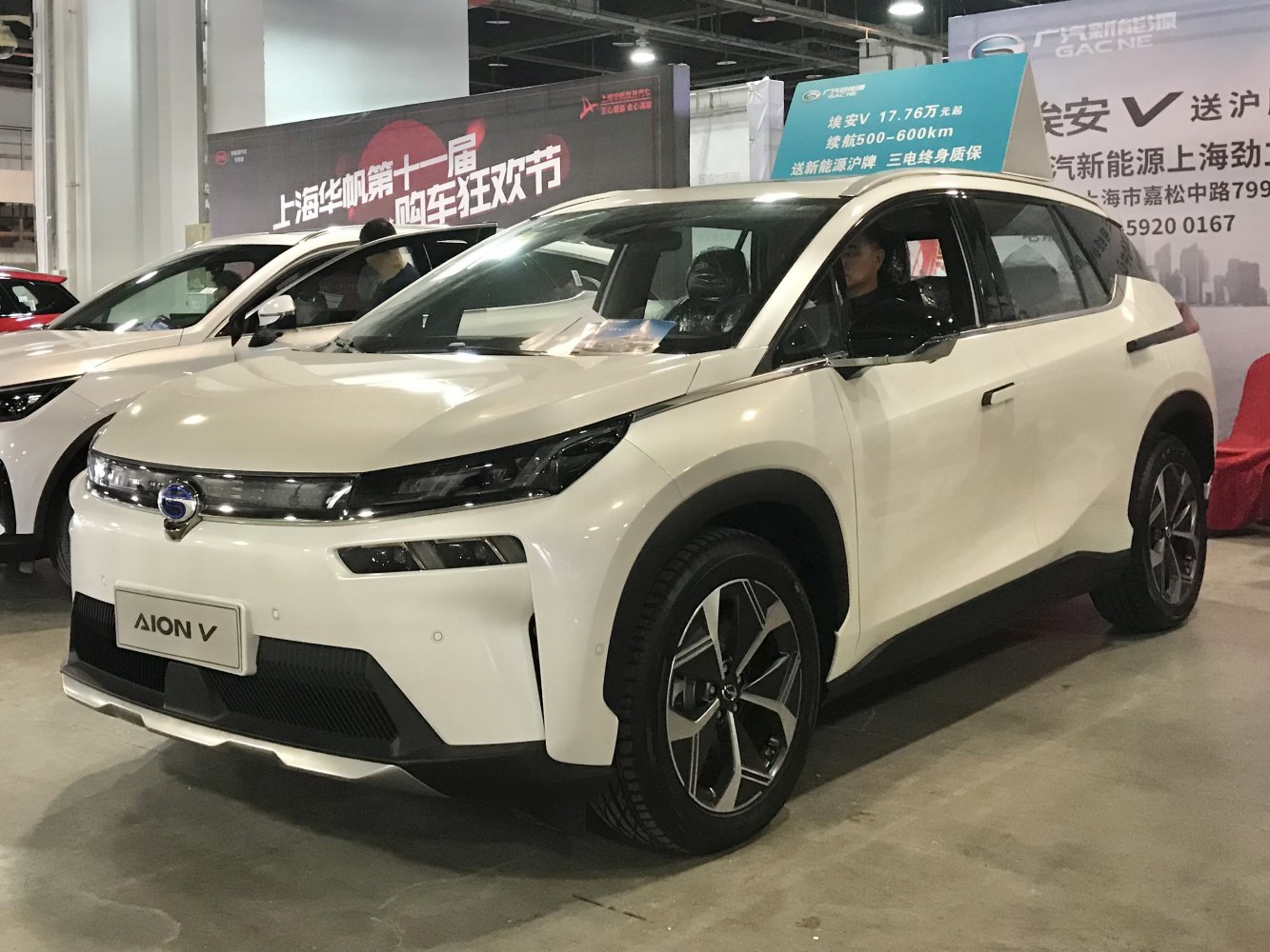 Front view of electric SUV with modern headlights and alloy wheels