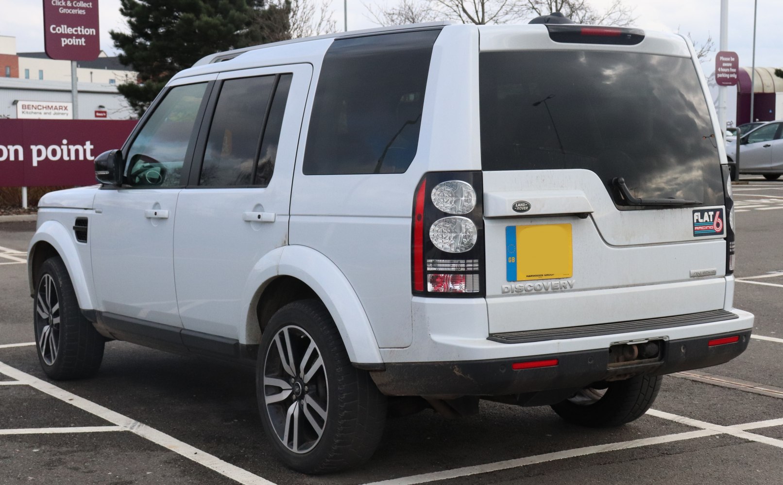 Rear side view of SUV with distinctive rear lights and tinted windows