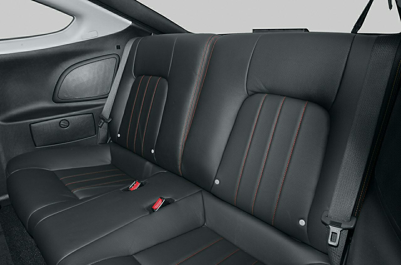 Black leather rear seats with red contrast stitching and seatbelt