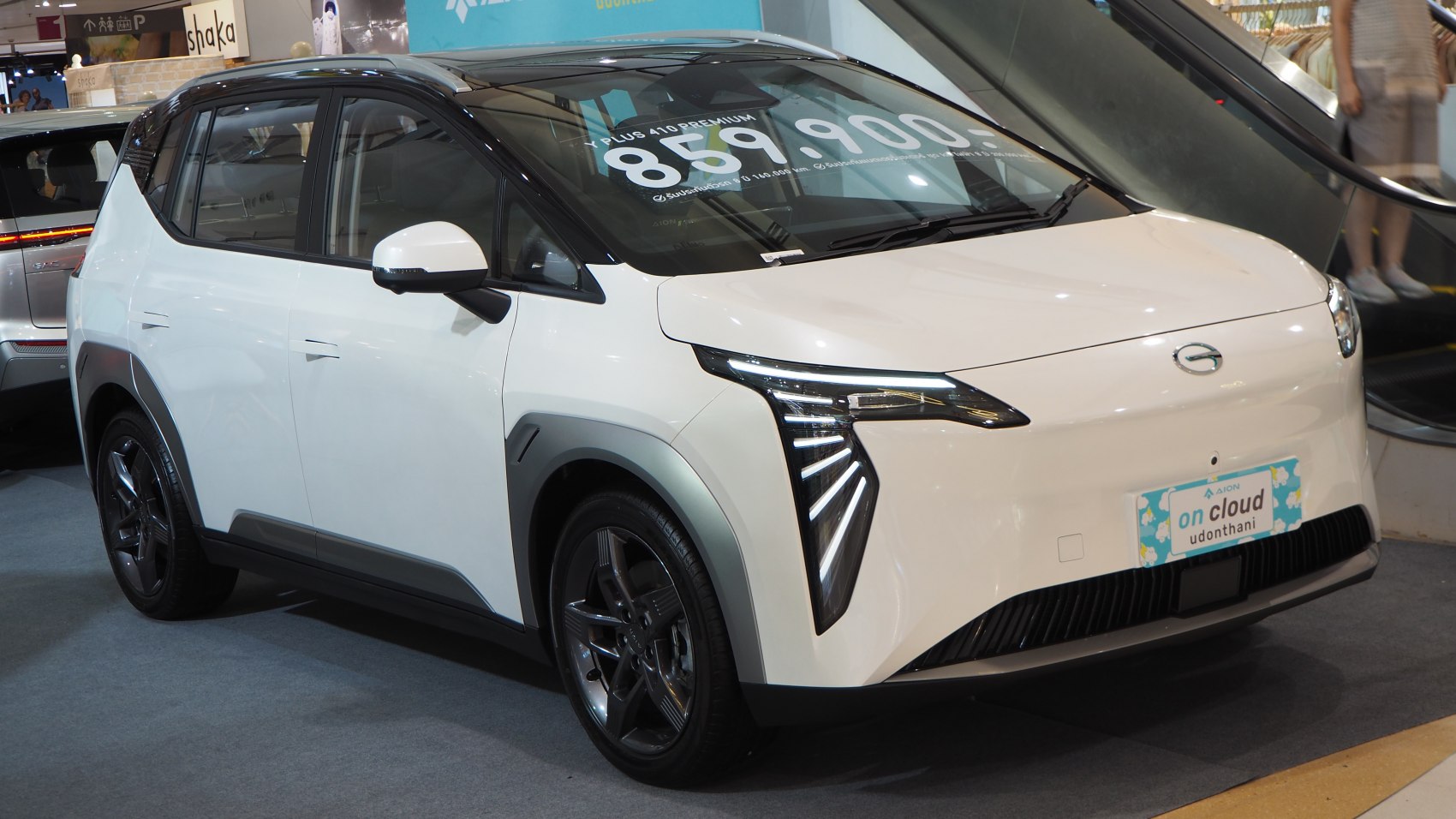 Sleek front LED light design and aerodynamic white compact SUV profile