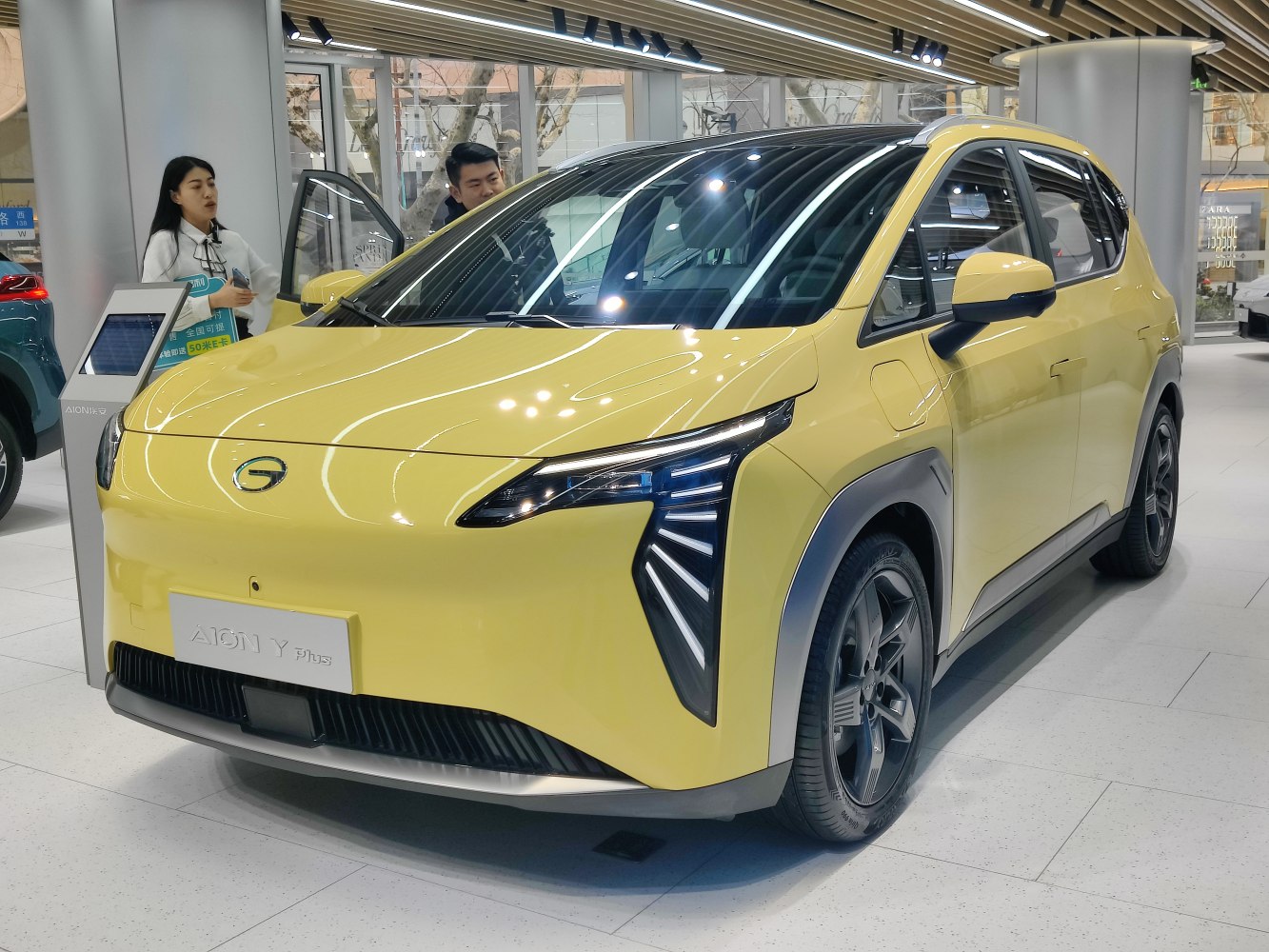 Sharp LED headlights and aerodynamic front design of a compact modern vehicle