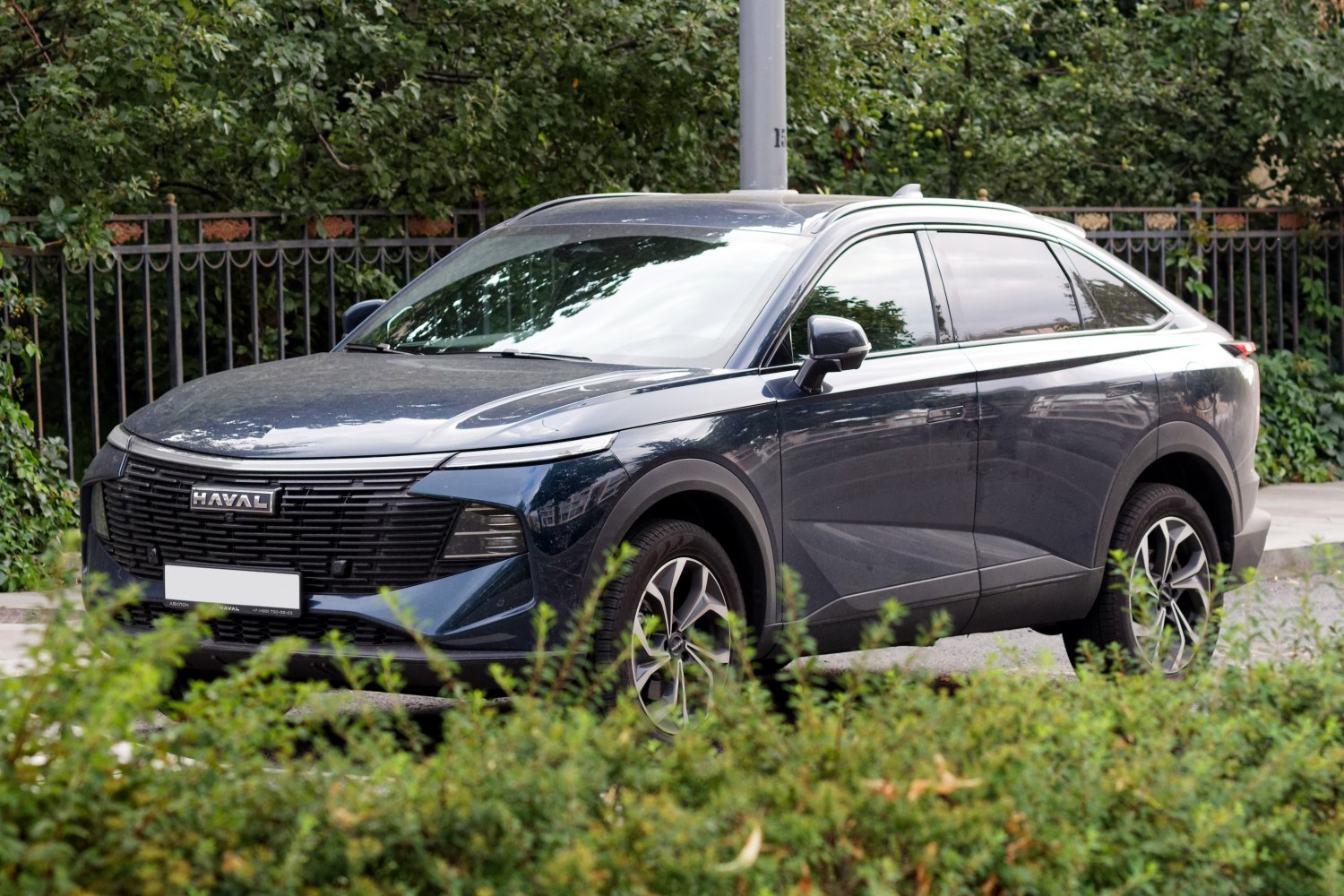 Modern SUV with distinctive front grille and sporty alloy wheels