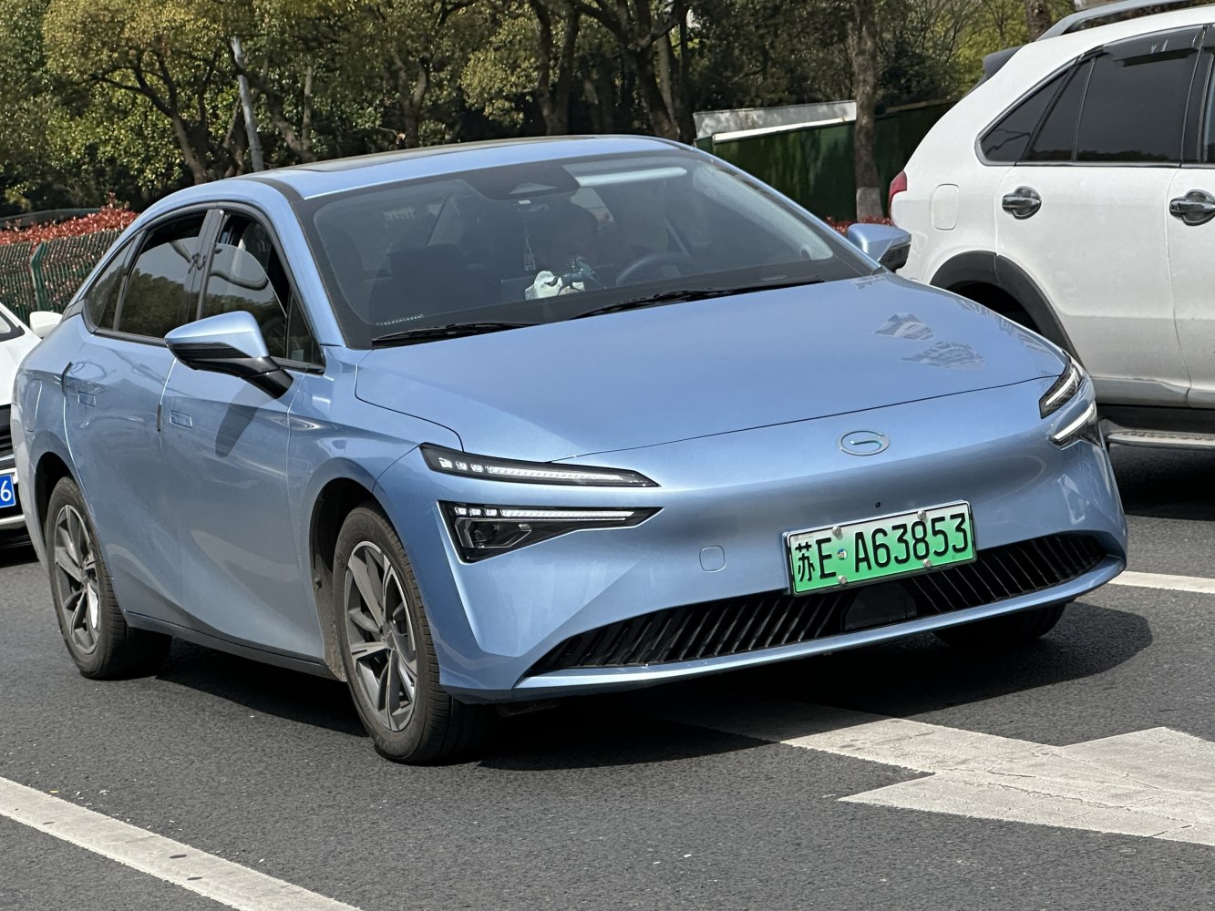 Front view of electric sedan with slim LED headlights and aerodynamic styling