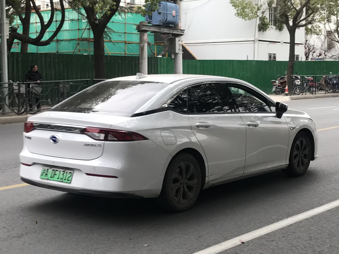 White sedan with sleek rear design and tinted windows