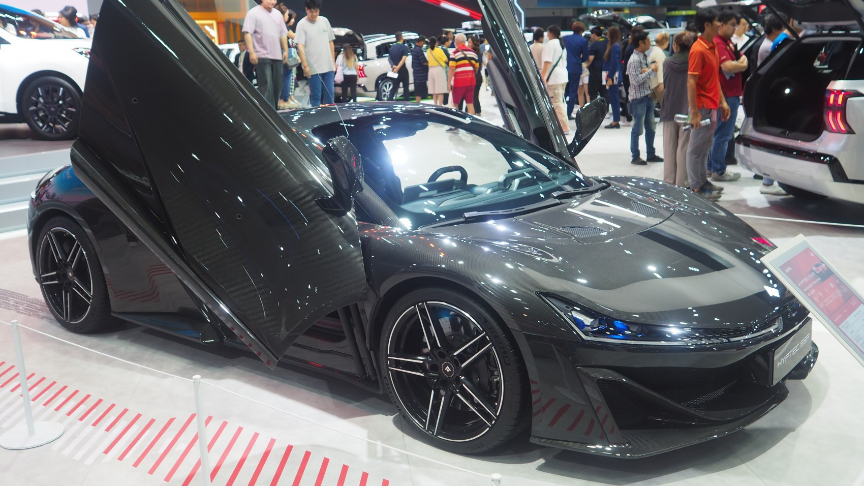Sports car with butterfly doors and aerodynamic body