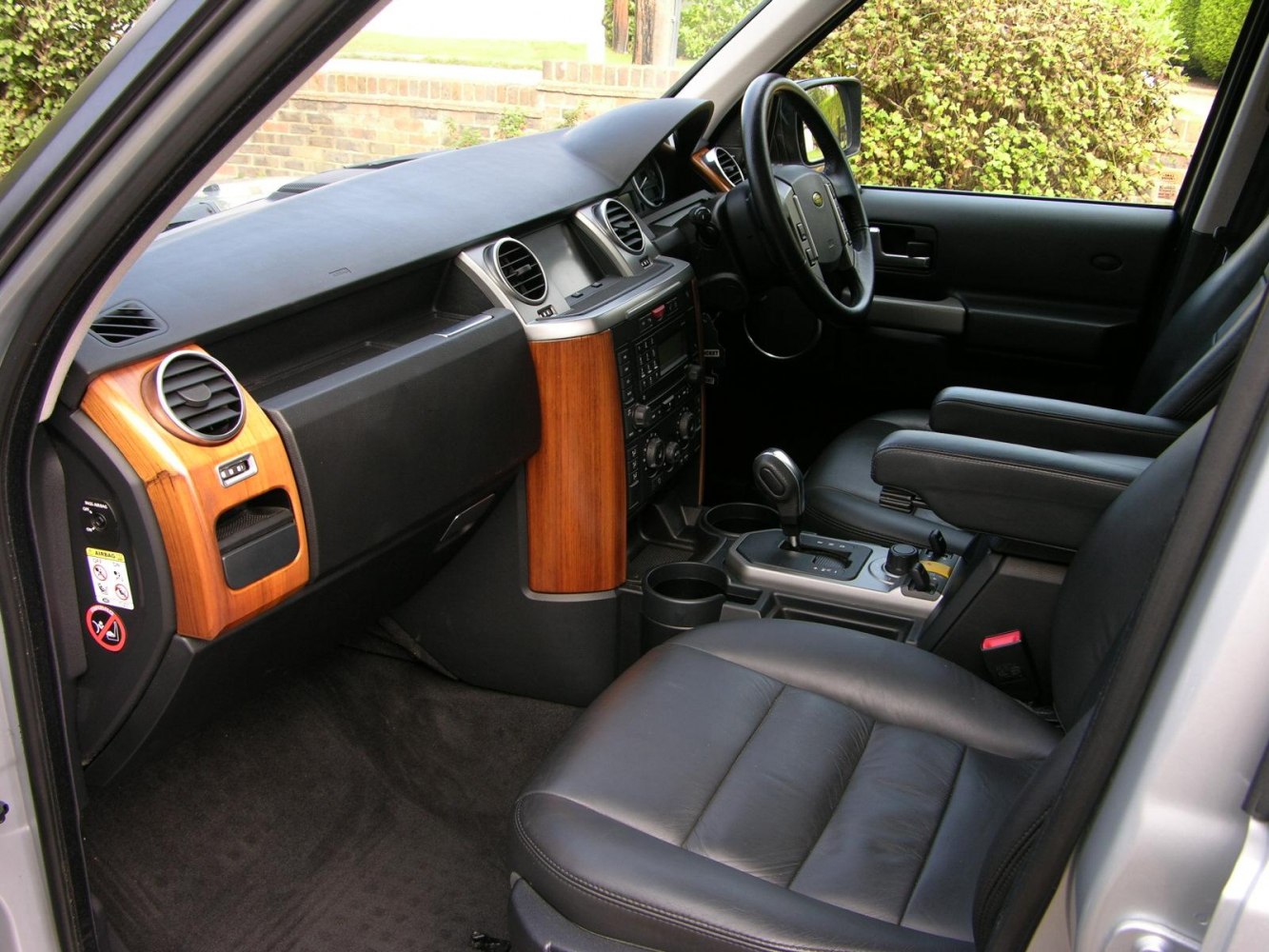Interior with leather seats and wood trim dashboard