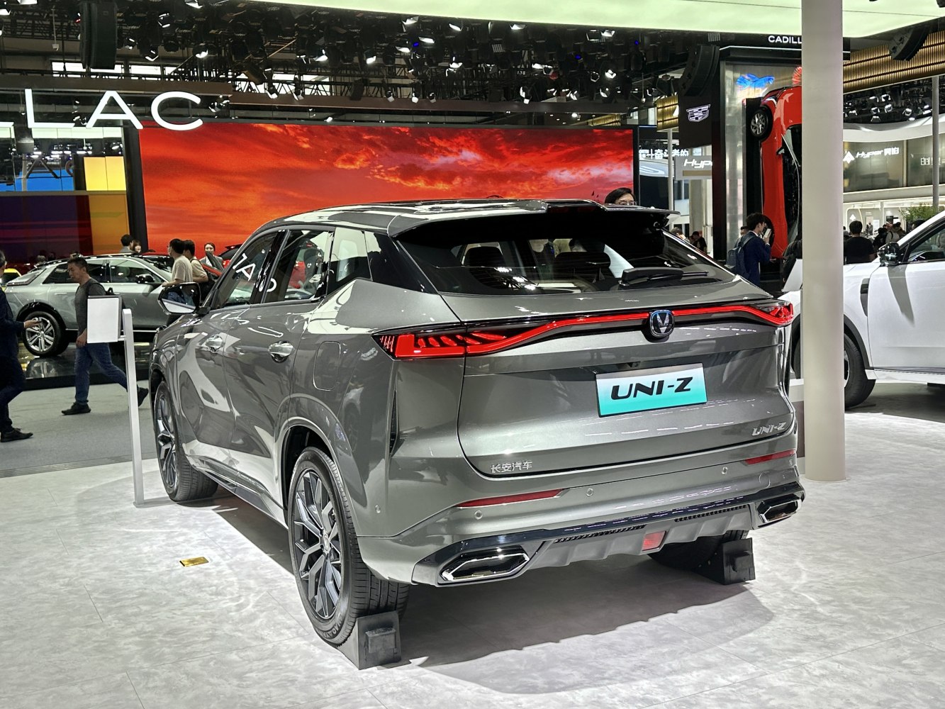 Sleek SUV rear design with continuous LED tail light strip and dual exhaust outlets.