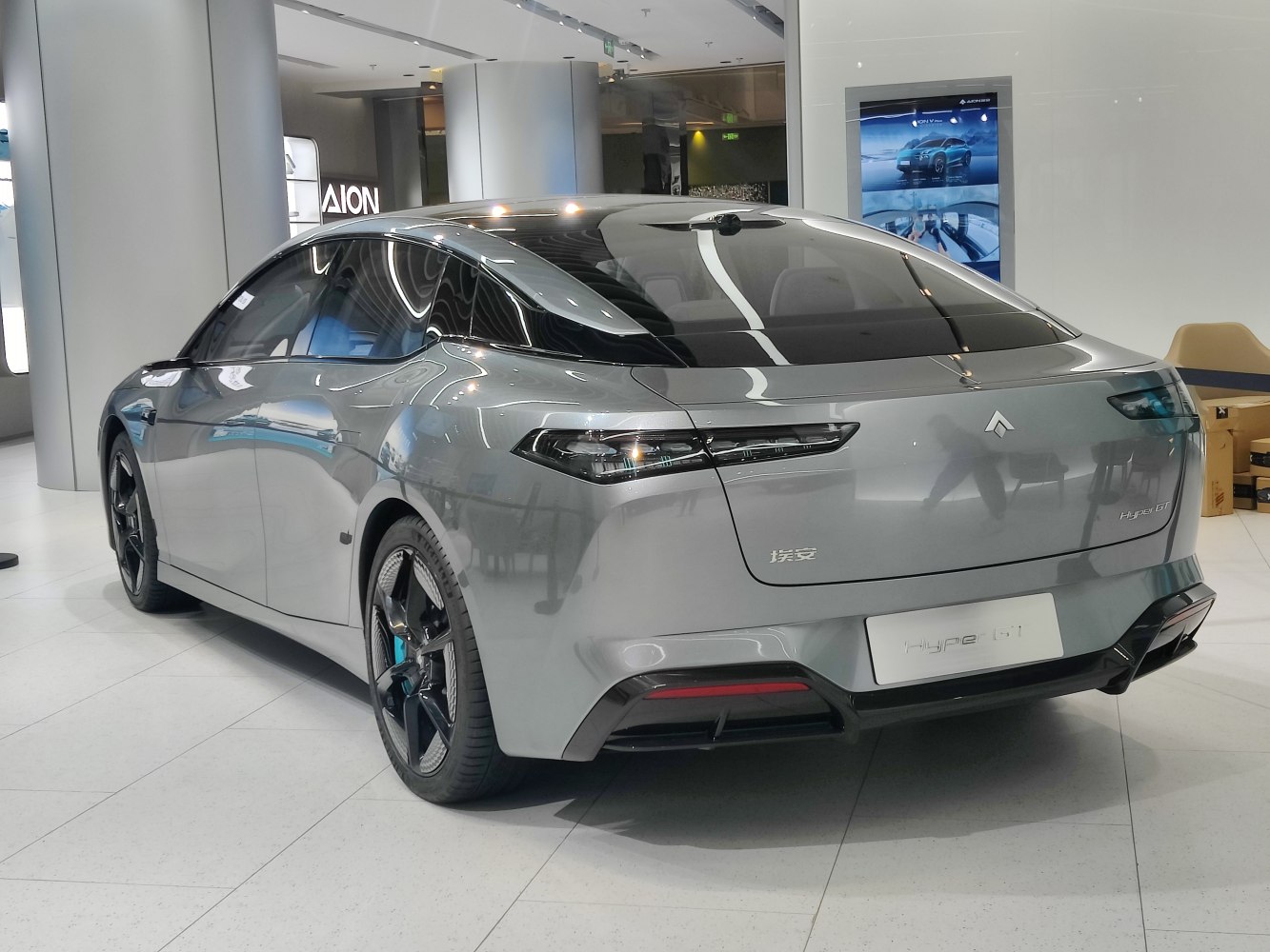 Rear view of electric sedan with LED taillights and aerodynamic roofline