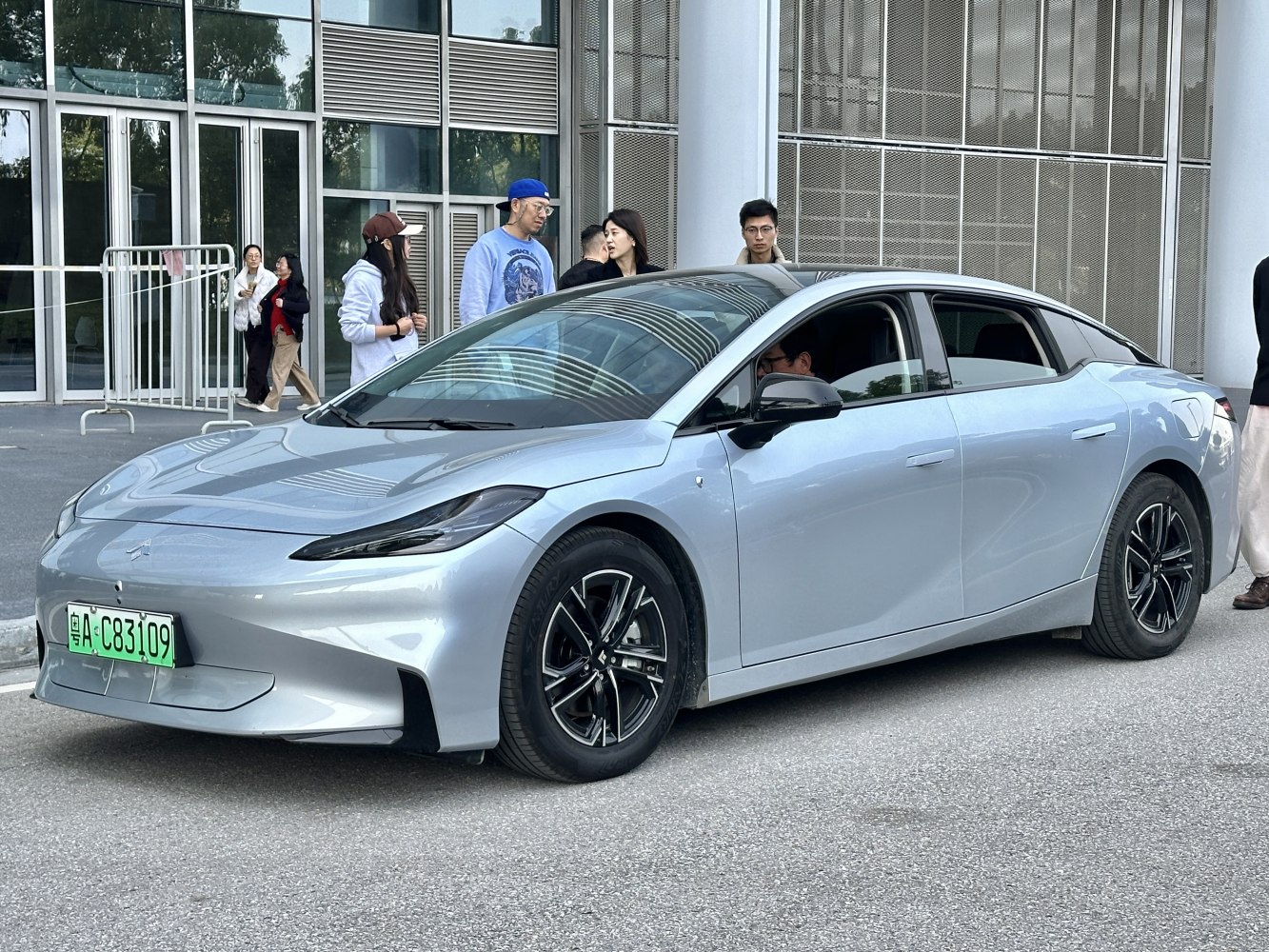 Aerodynamic electric sedan with sleek LED headlights and alloy wheels