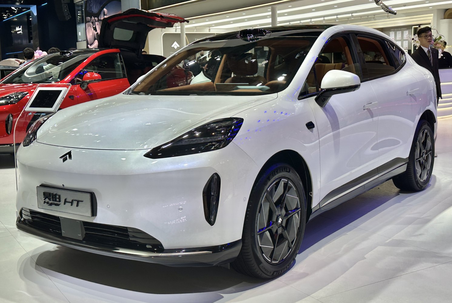 Sleek aerodynamic electric vehicle front with futuristic headlights