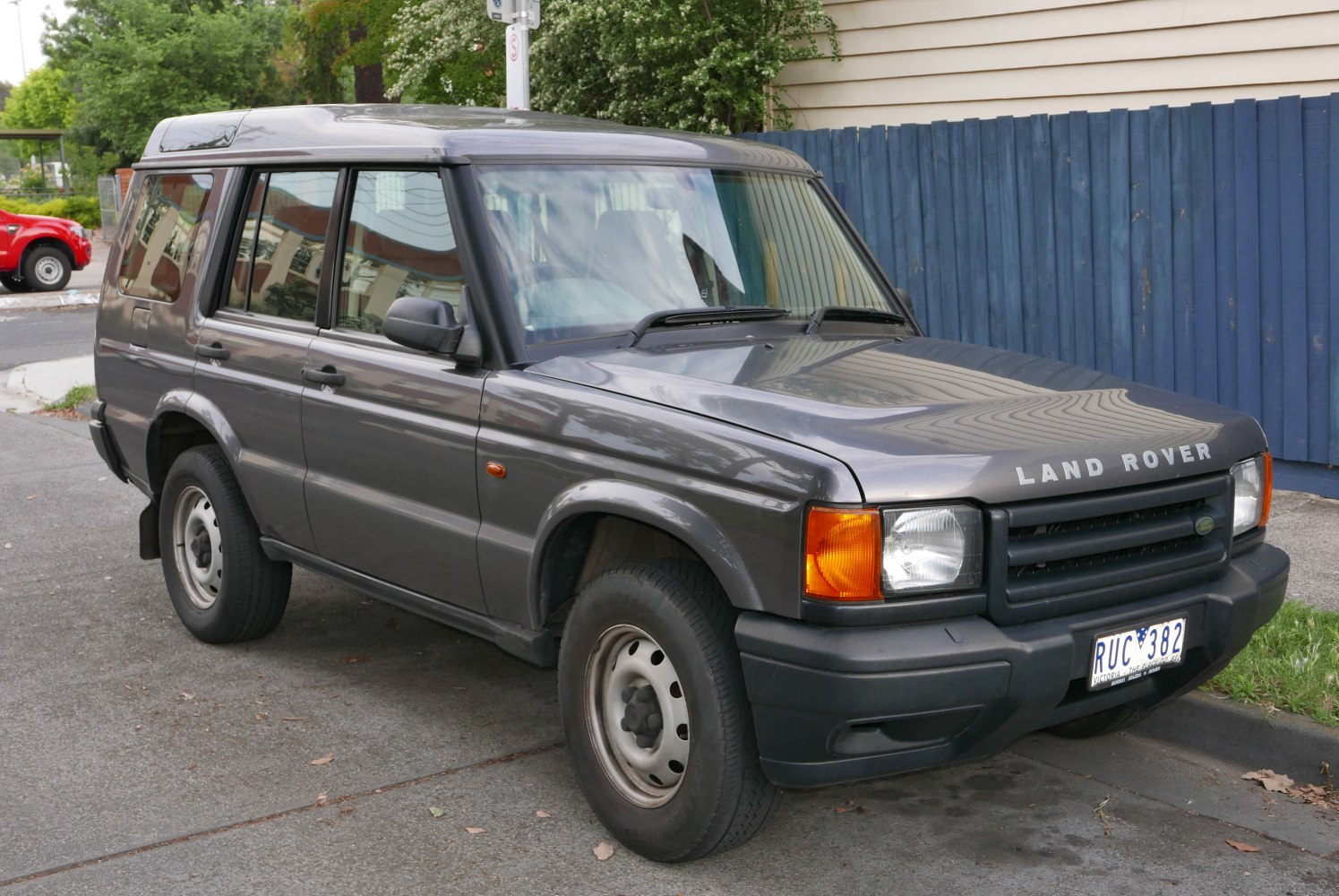 Boxy SUV with distinct front grille and side view, classic offroad design