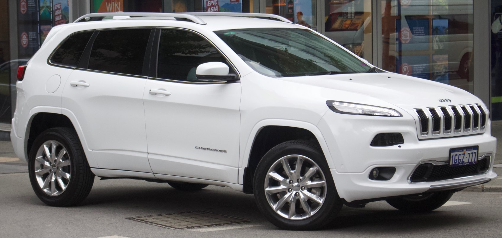 Front-side view with seven-slot grille and sleek body lines