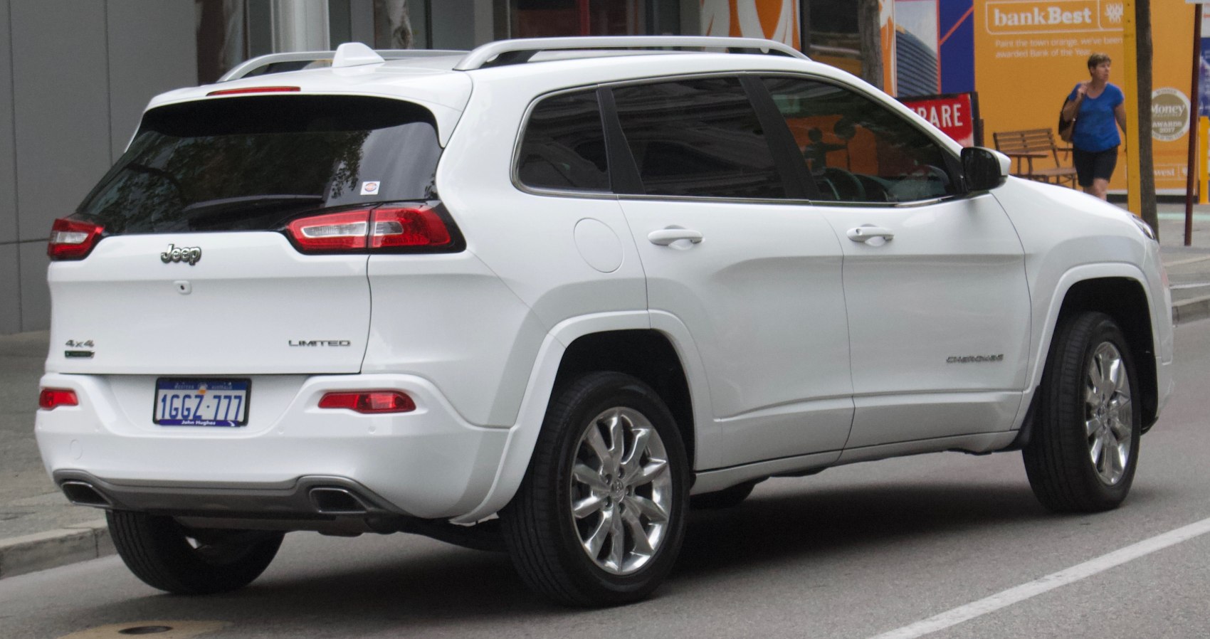 Rear view of white SUV with distinct tail lights and 4x4 badge