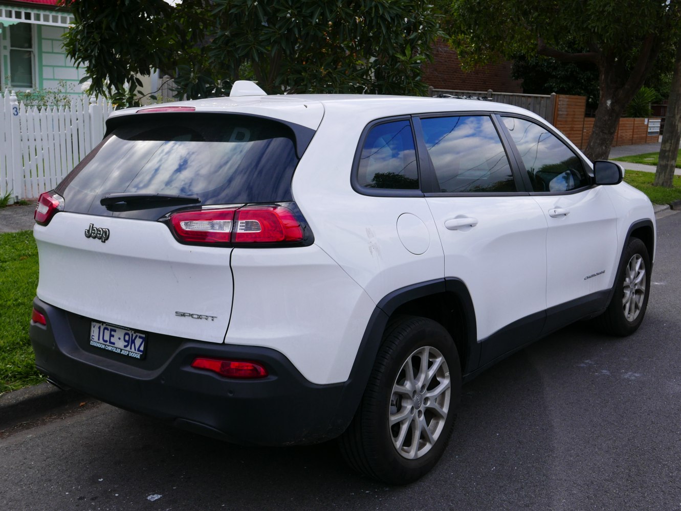 White SUV rear and side view with distinct tail lights and tinted windows