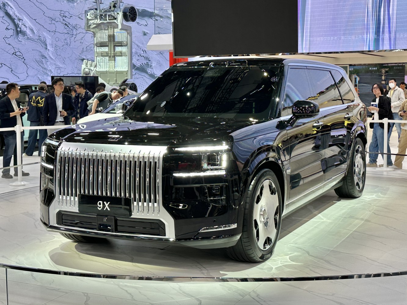 Luxury SUV with vertical chrome grille and LED headlights