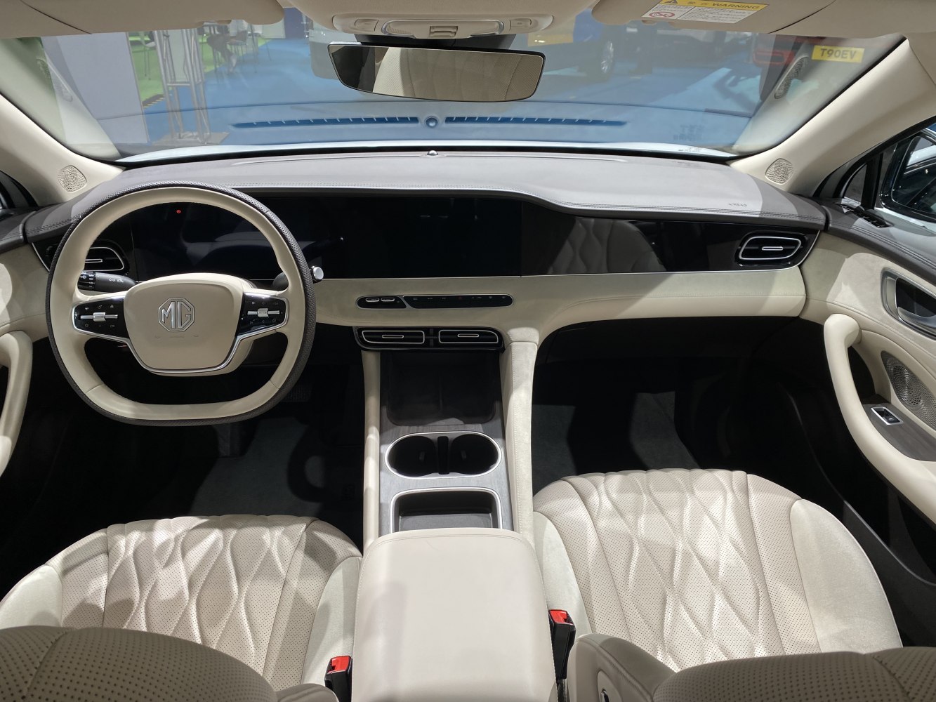 Luxury car interior with digital dashboard and beige leather seats
