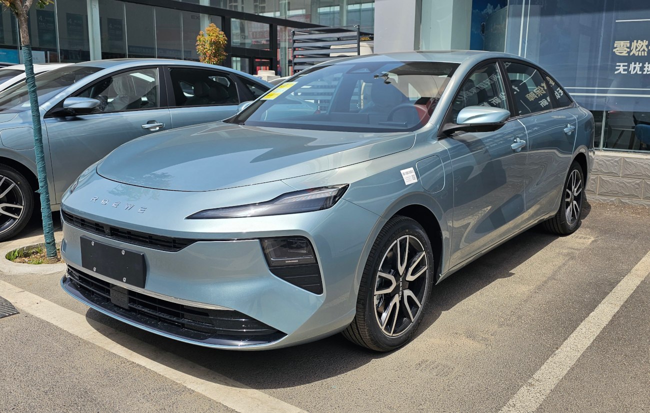 Front view of modern sedan with sleek LED headlights and aerodynamic design