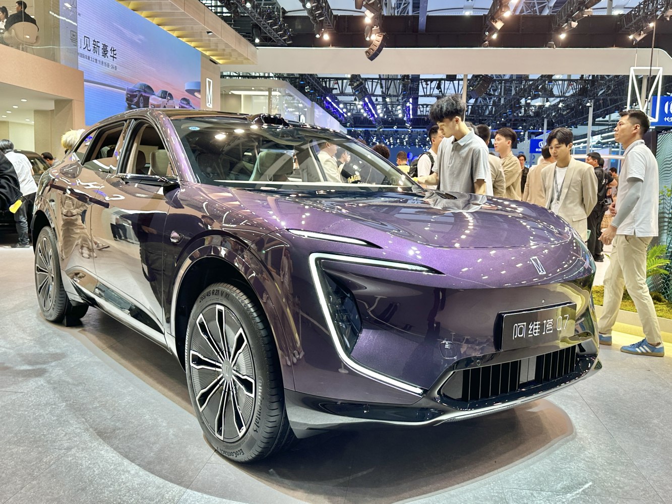Front angled view of a sleek purple electric SUV with modern headlights