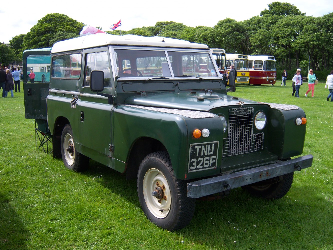 Off-road utility vehicle with front grille and round headlights