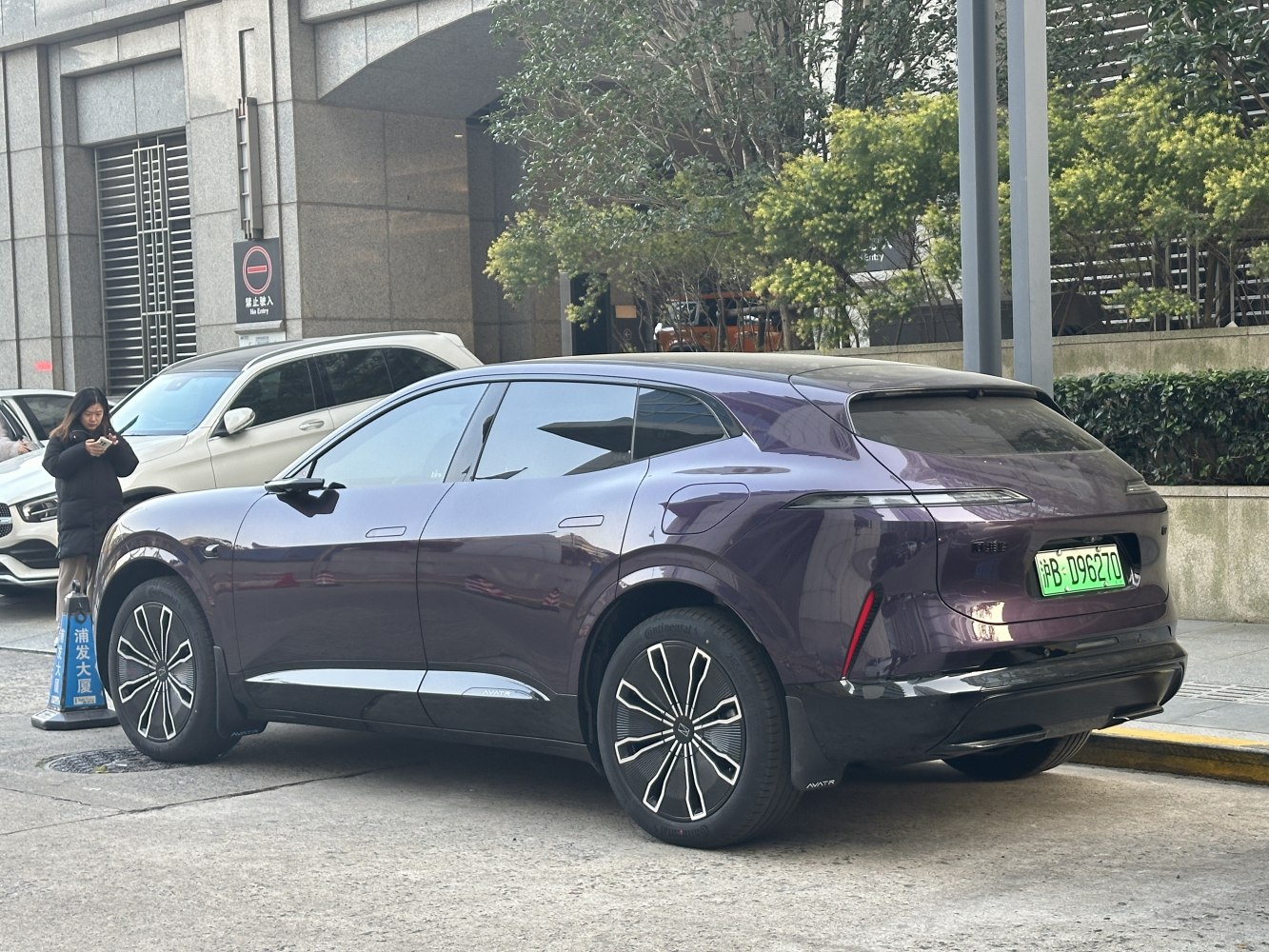 Modern SUV with sleek body, distinctive rear lights, and futuristic alloy wheels