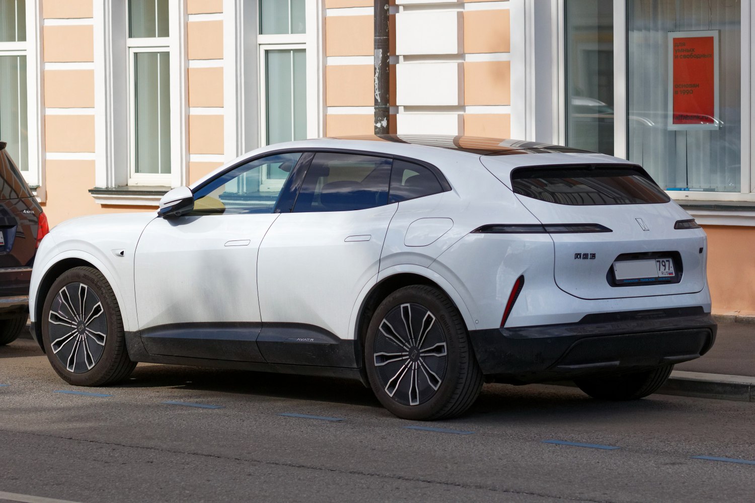Rear side profile of modern electric SUV with LED taillights and aerodynamic design