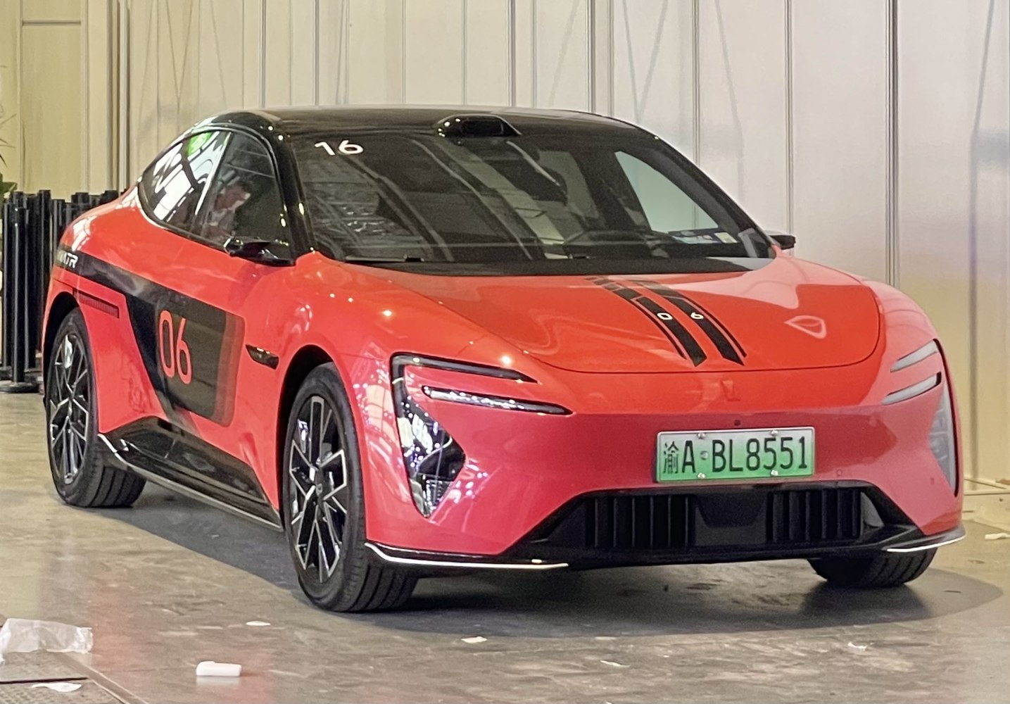 Sleek electric coupe front with LED lights and aerodynamic design