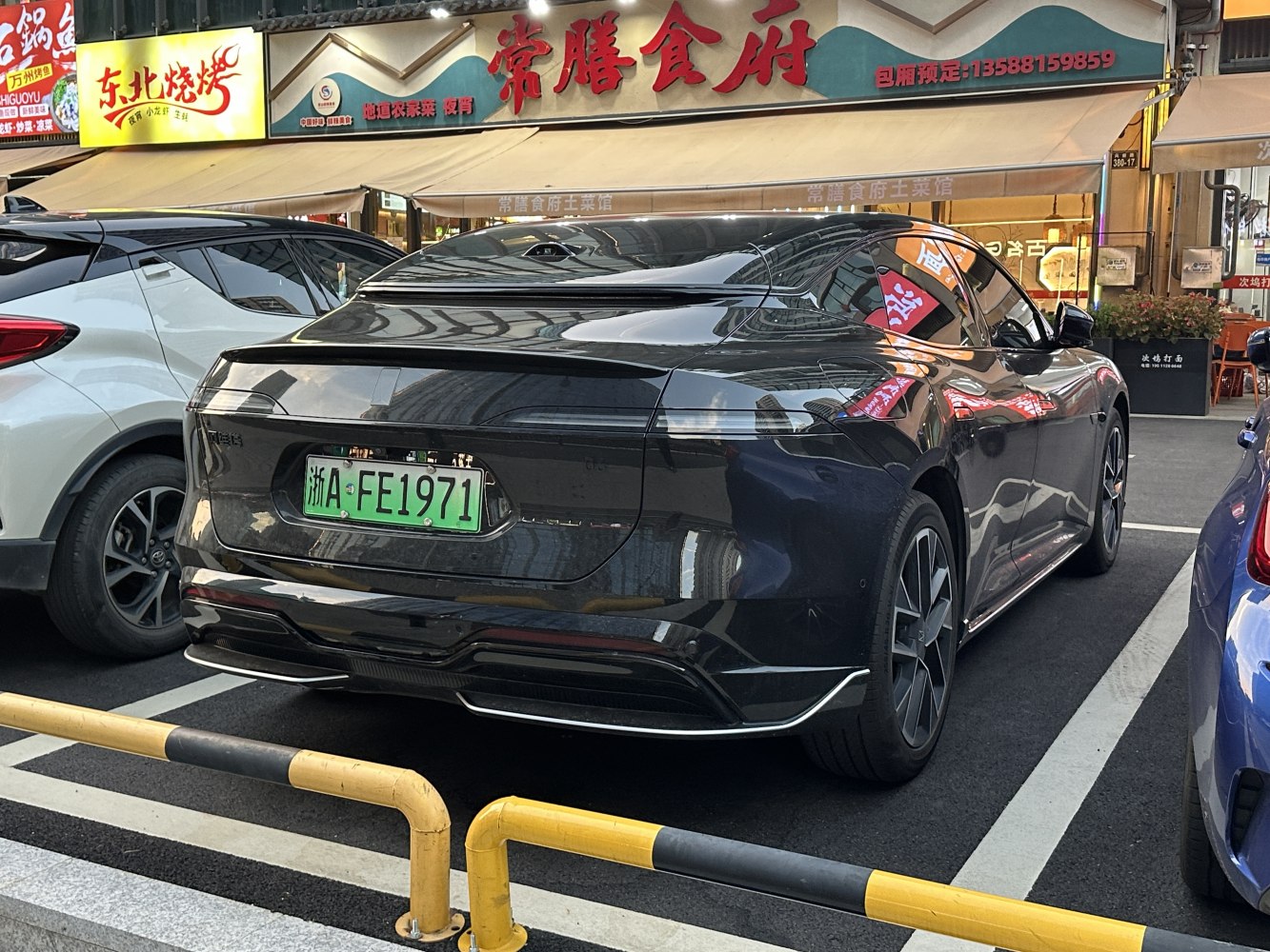 Sleek rear design with continuous taillight strip and smooth aerodynamic shape