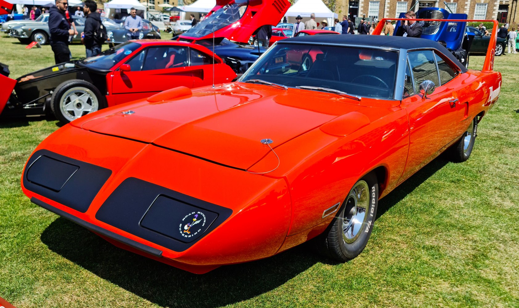 Muscle car with aerodynamic nose cone and tall rear wing