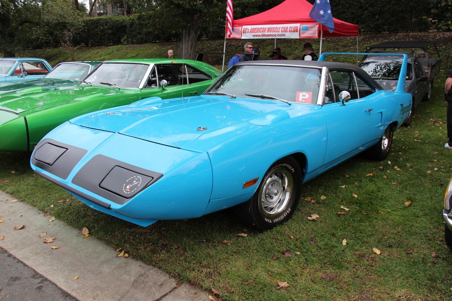 Aerodynamic nose cone and tall rear wing of a classic muscle car