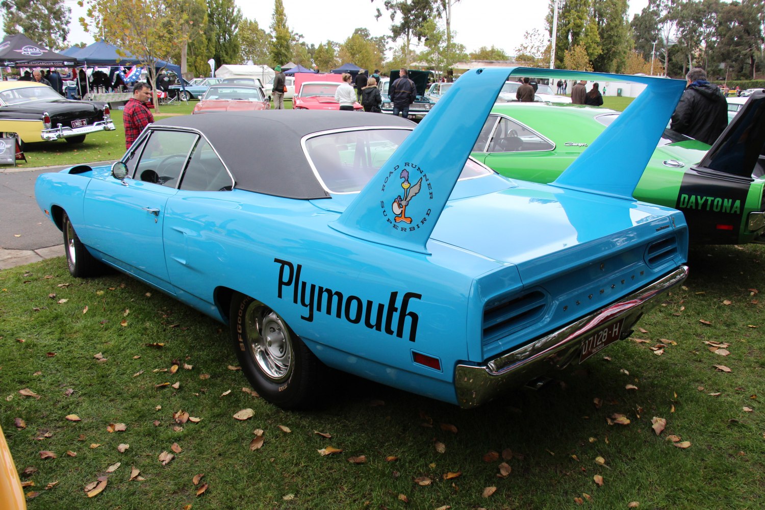 High rear wing and classic muscle design of a vintage car.
