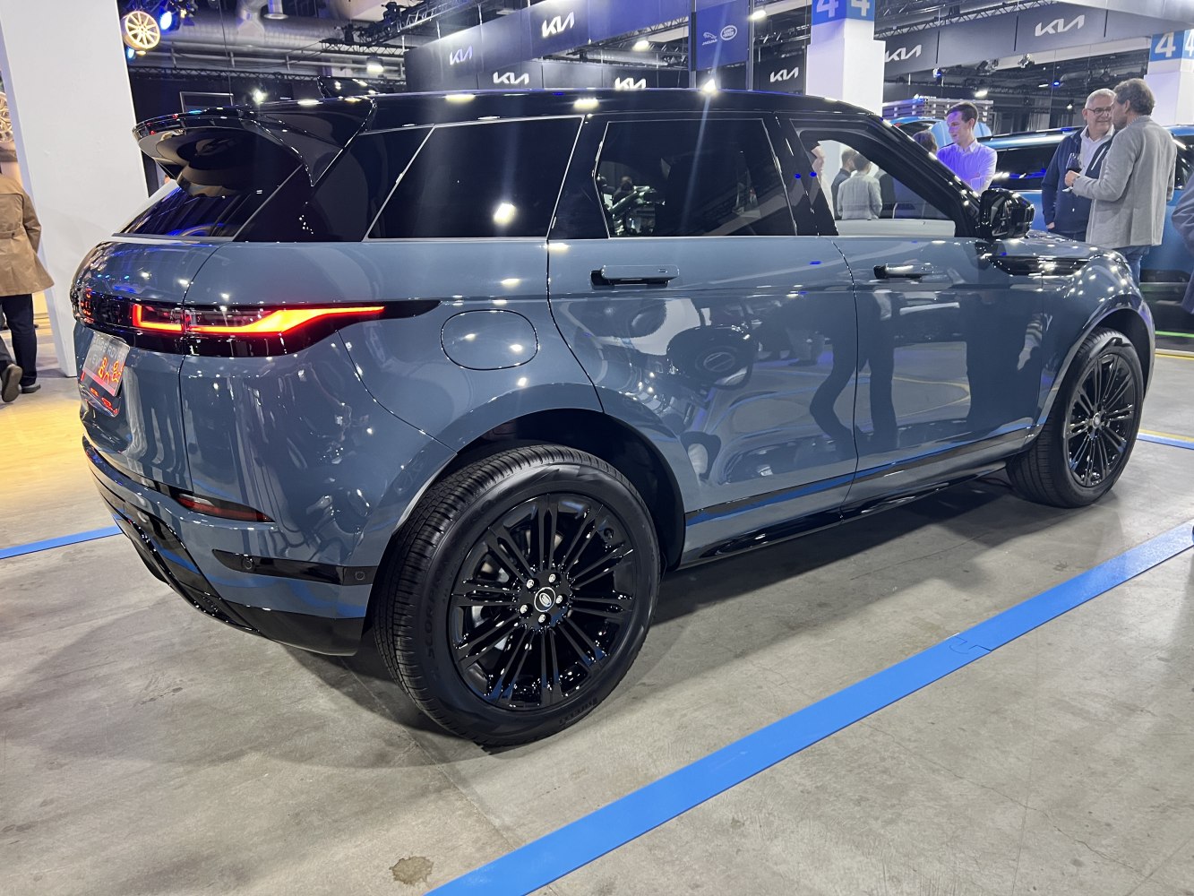 Rear and side profile of modern compact SUV with black alloy wheels and tinted windows