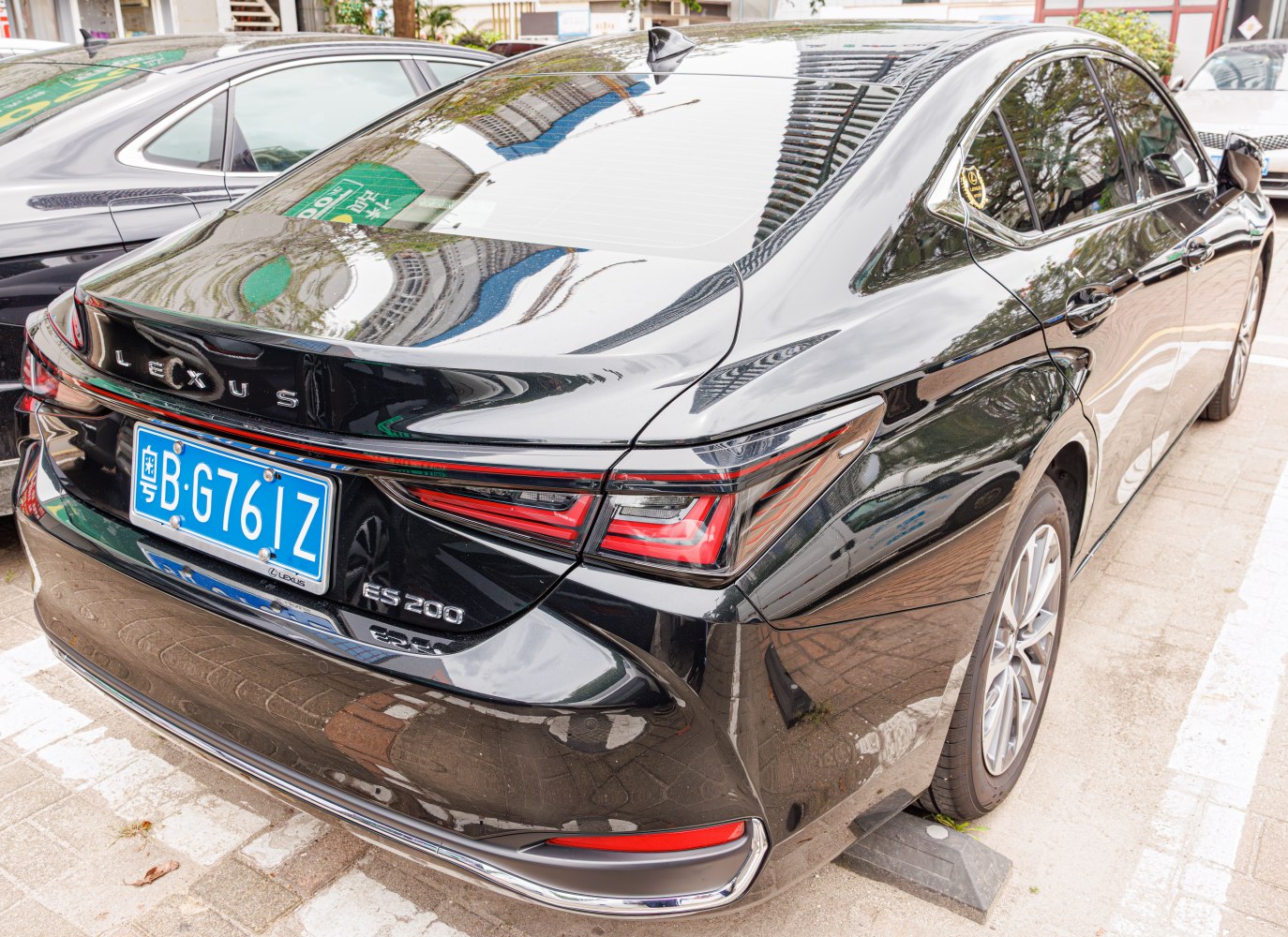 Sleek rear design with sharp LED tail lights and glossy black finish.