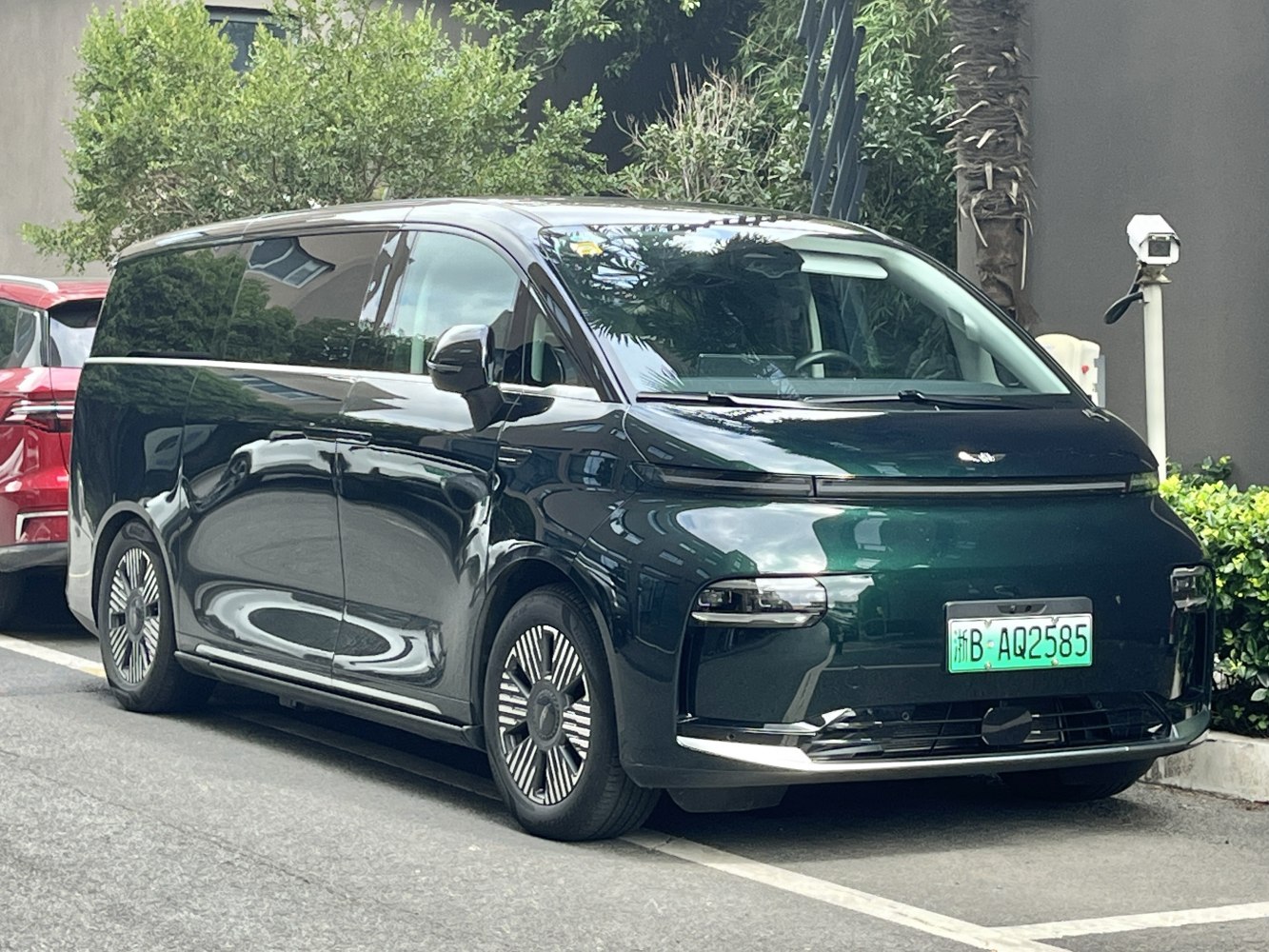 Sleek modern MPV front and side with aerodynamic design and unique wheel styling