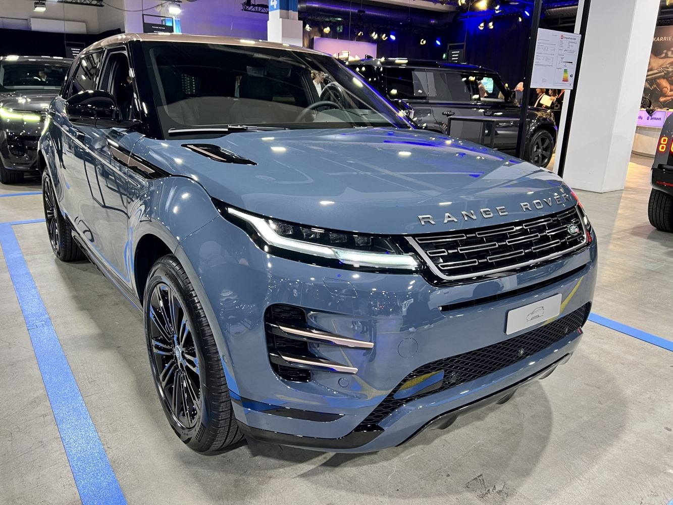Sleek front profile with LED headlights and distinctive grille of a luxury SUV